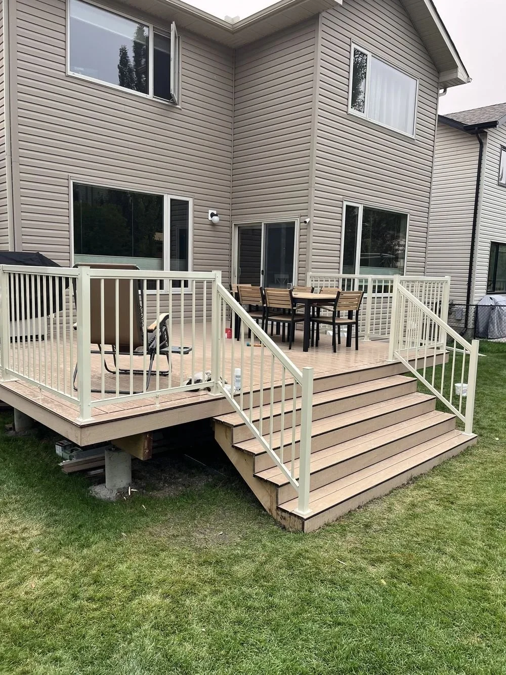 Custom Elevated Custom Backyard Wood Deck with Stairs and Aluminum Railing