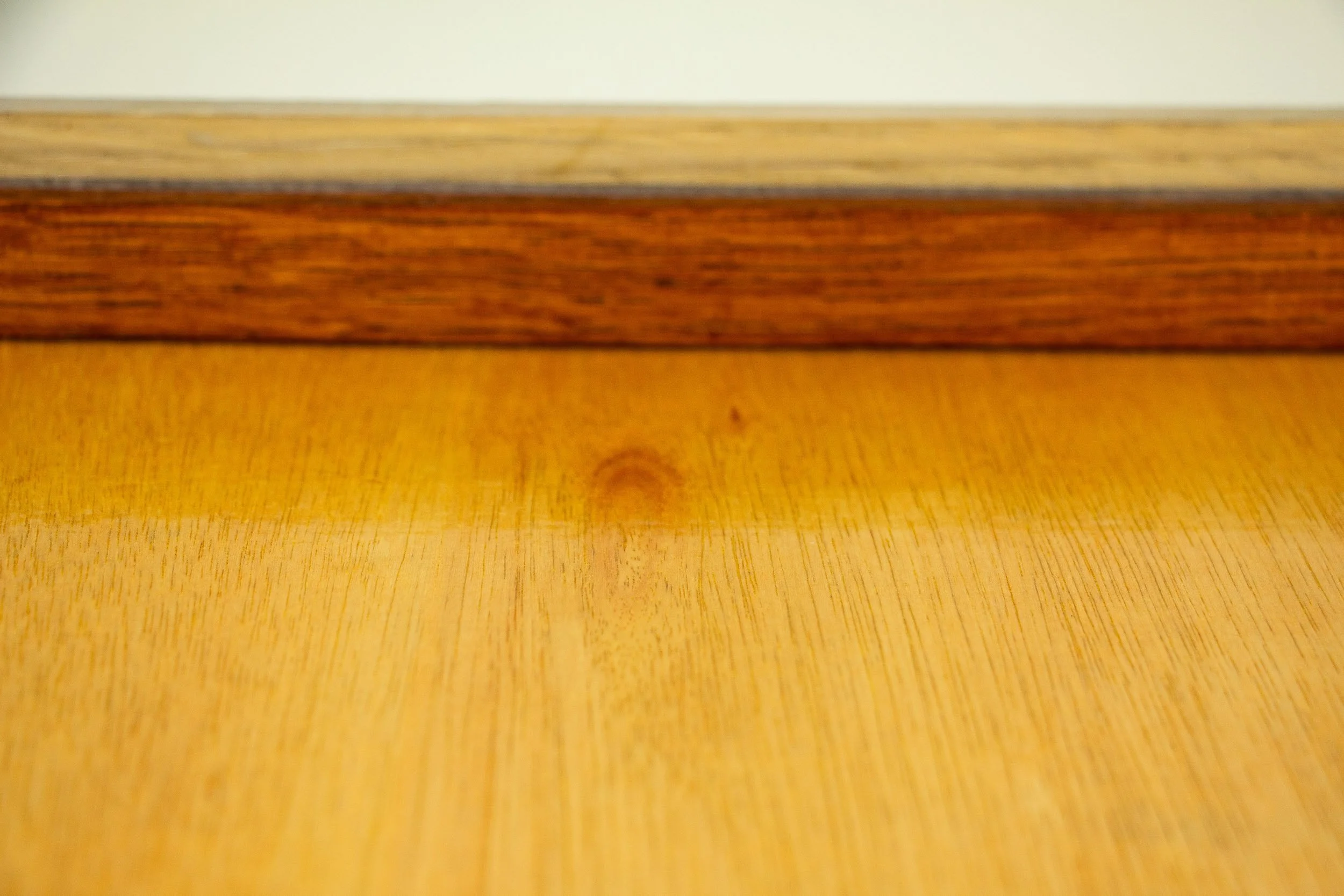  Mêlée of Discovery 002 frame: back detail focused on the warm-toned backing panel and inner wooden strip, highlighting the frame’s material depth and handmade finish.