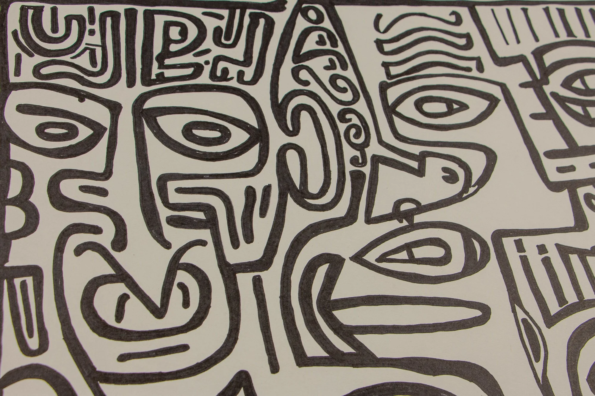 Elusive Cocoon 004 detail: broader close-up of adjoining face-like forms with almond eyes, spiral cheek lines, stepped contours, and elongated mouths rendered in dense black linework.