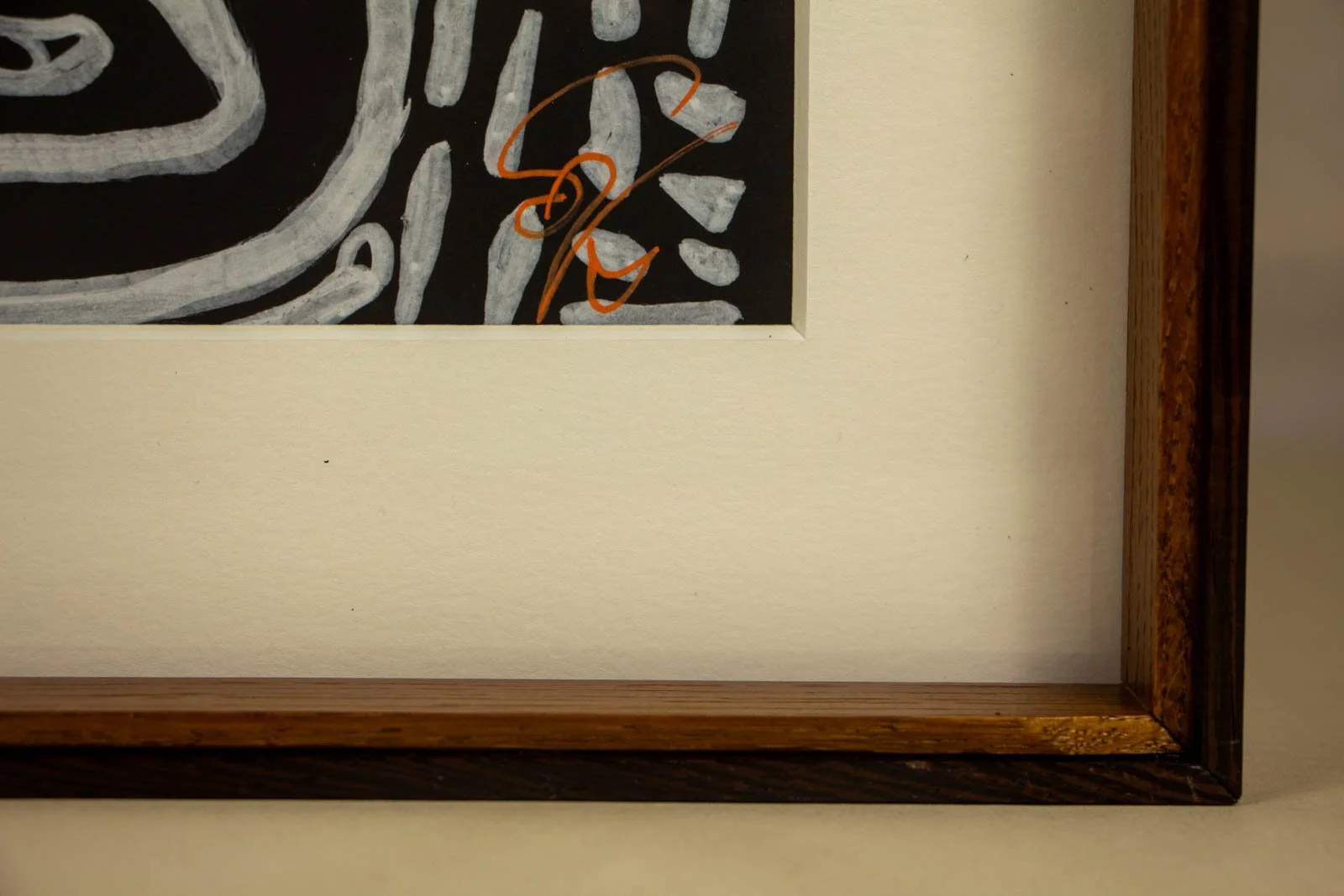 Metamorphic Entwining 001 frame: lower-right signature behind glass, cherry-toned oak and wengé trim visible