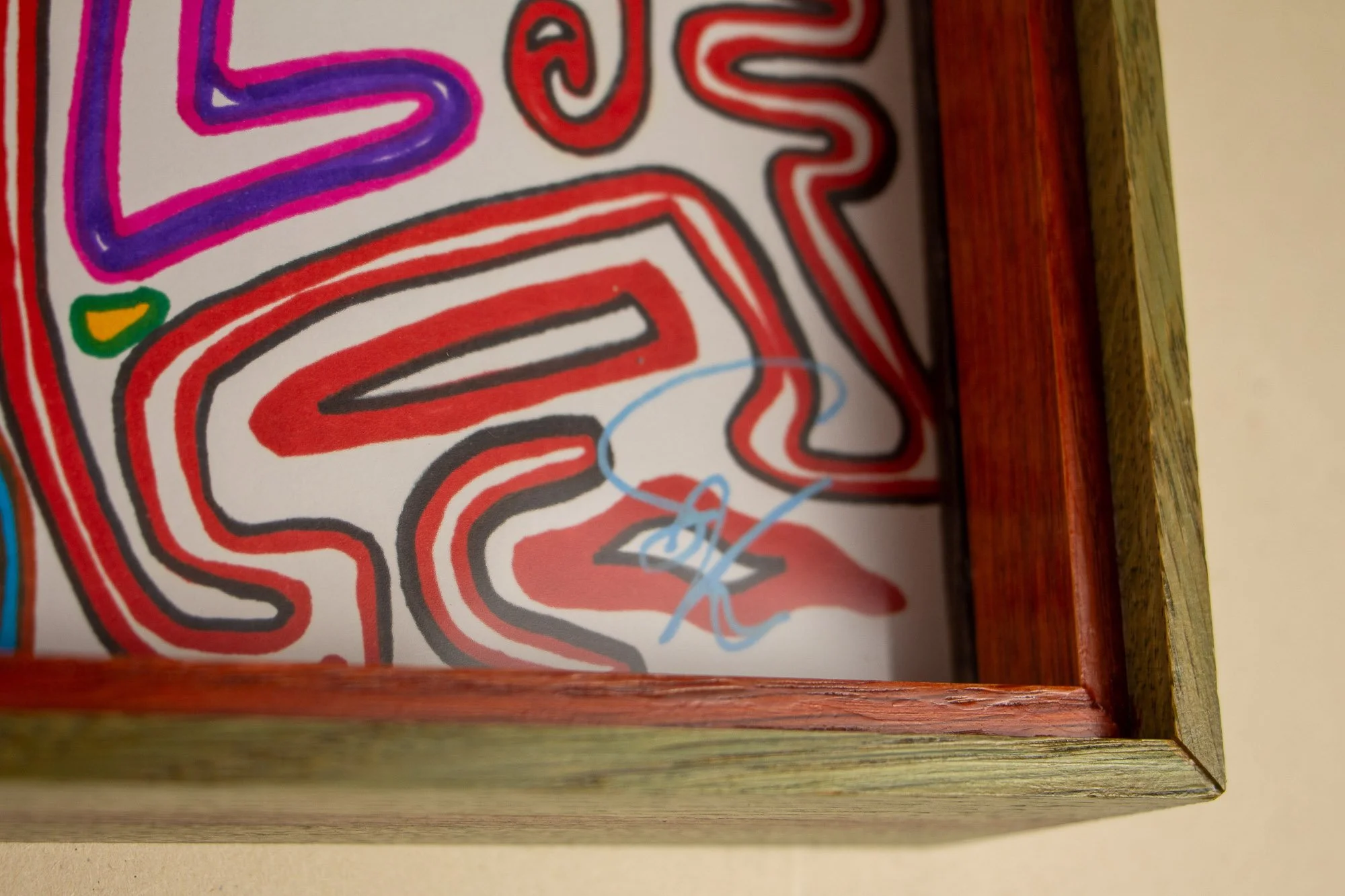 Eclipsing Gravitas 001 frame: reverse-side view with meranti plywood back panel, steel hanging wire, and green-toned inner rim fixed within the rear frame construction.