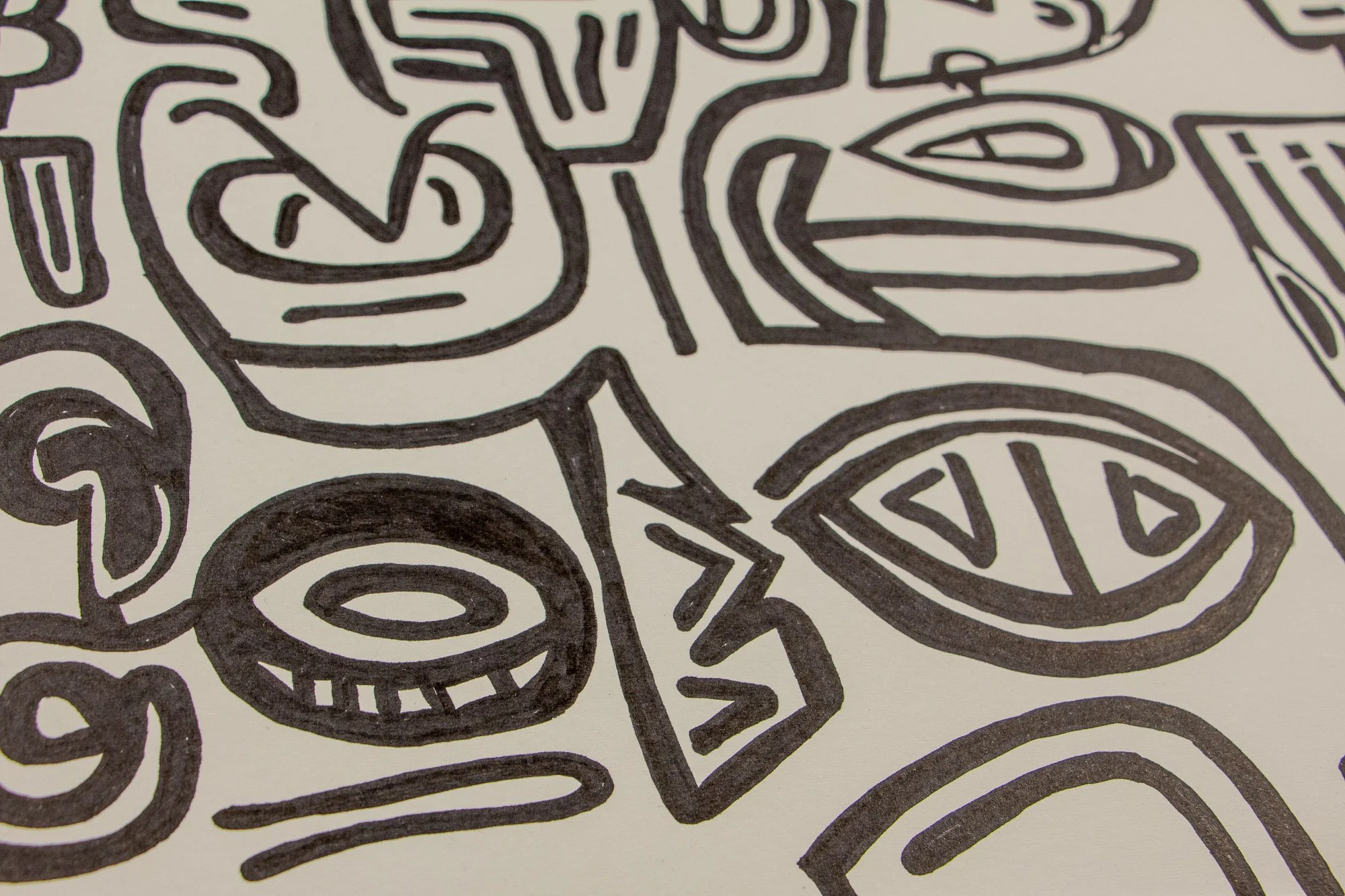 Elusive Cocoon 004 detail: close-up of a bold almond eye, circular ring-like form, and zigzag geometric accent, surrounded by curving black contours on warm white paper.