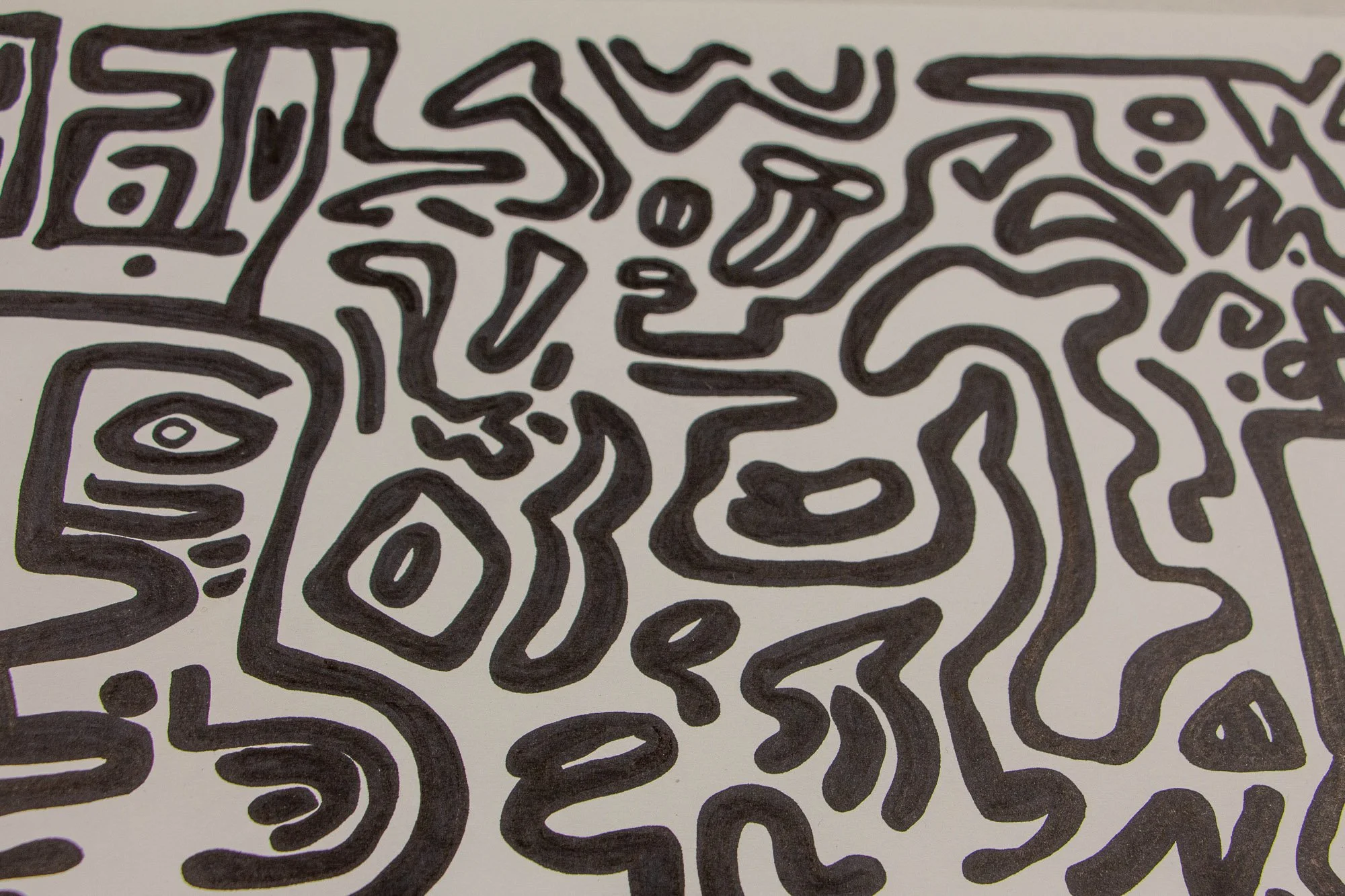 Veiled Alchemist 003 detail: close-up of the upper field of the drawing, showing fluid black lines, symbolic shapes, and a dense network of abstract forms unfolding across the white ground.