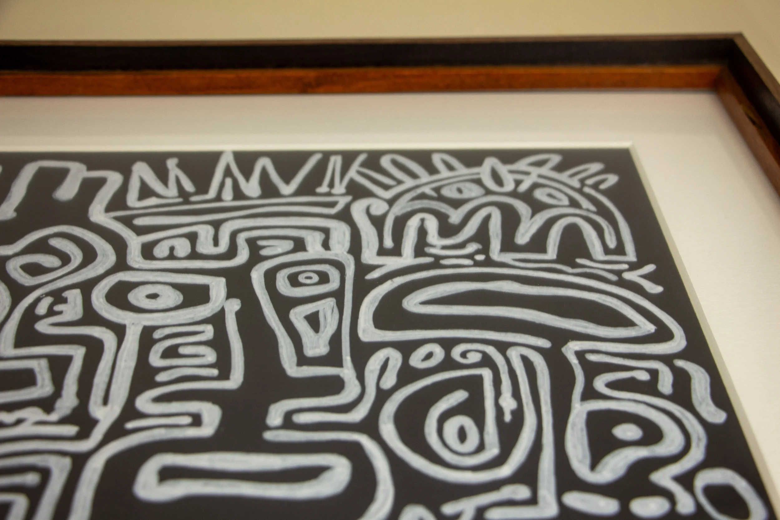 Mêlée of Discovery 003 frame: upper front detail showing the black artwork field, white mount, and warm inner lip set within the darker outer frame.