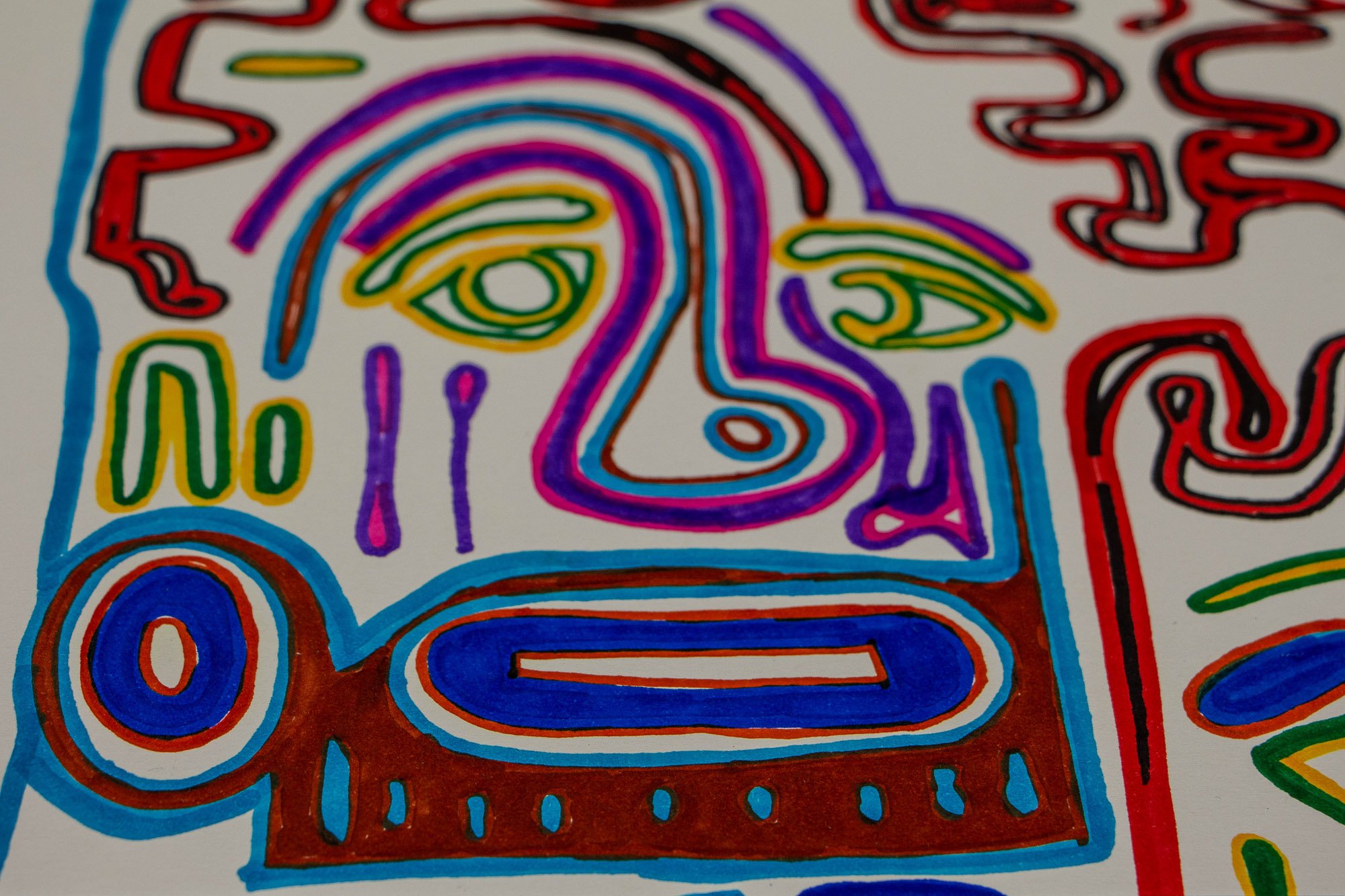 Eclipsing Gravitas 002 detail: close-up of a face-like figure outlined in cyan, purple, and pink, with asymmetrical green eyes, a rounded nose, and a blue oval mouth set above a brown lower section.