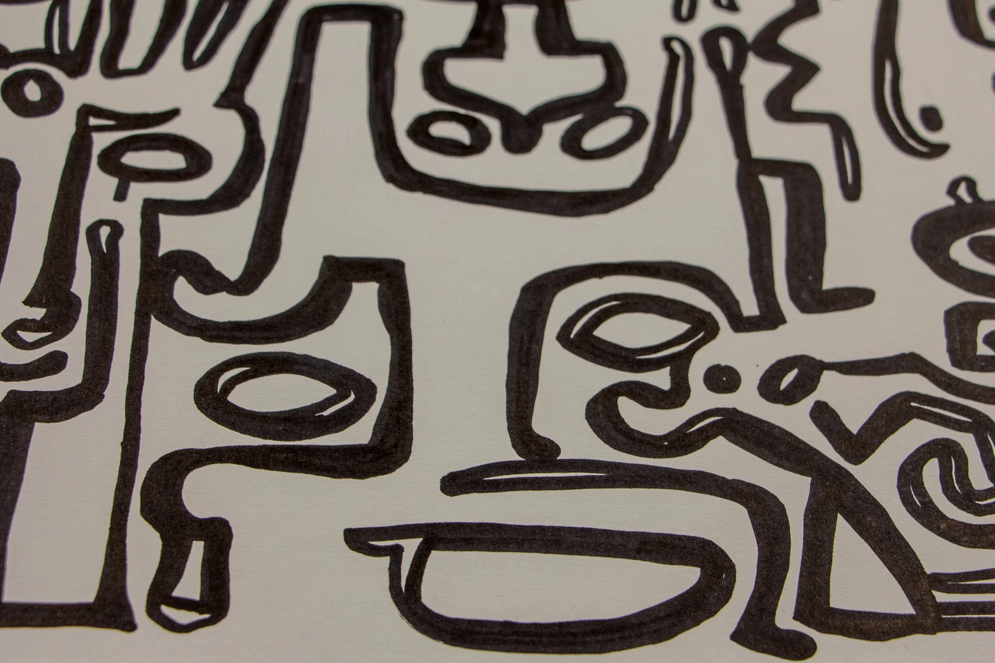 Veiled Alchemist 002 detail: close-up of a simplified face with oval eyes and a long horizontal mouth, surrounded by adjoining abstract forms and thick black contours on white paper.