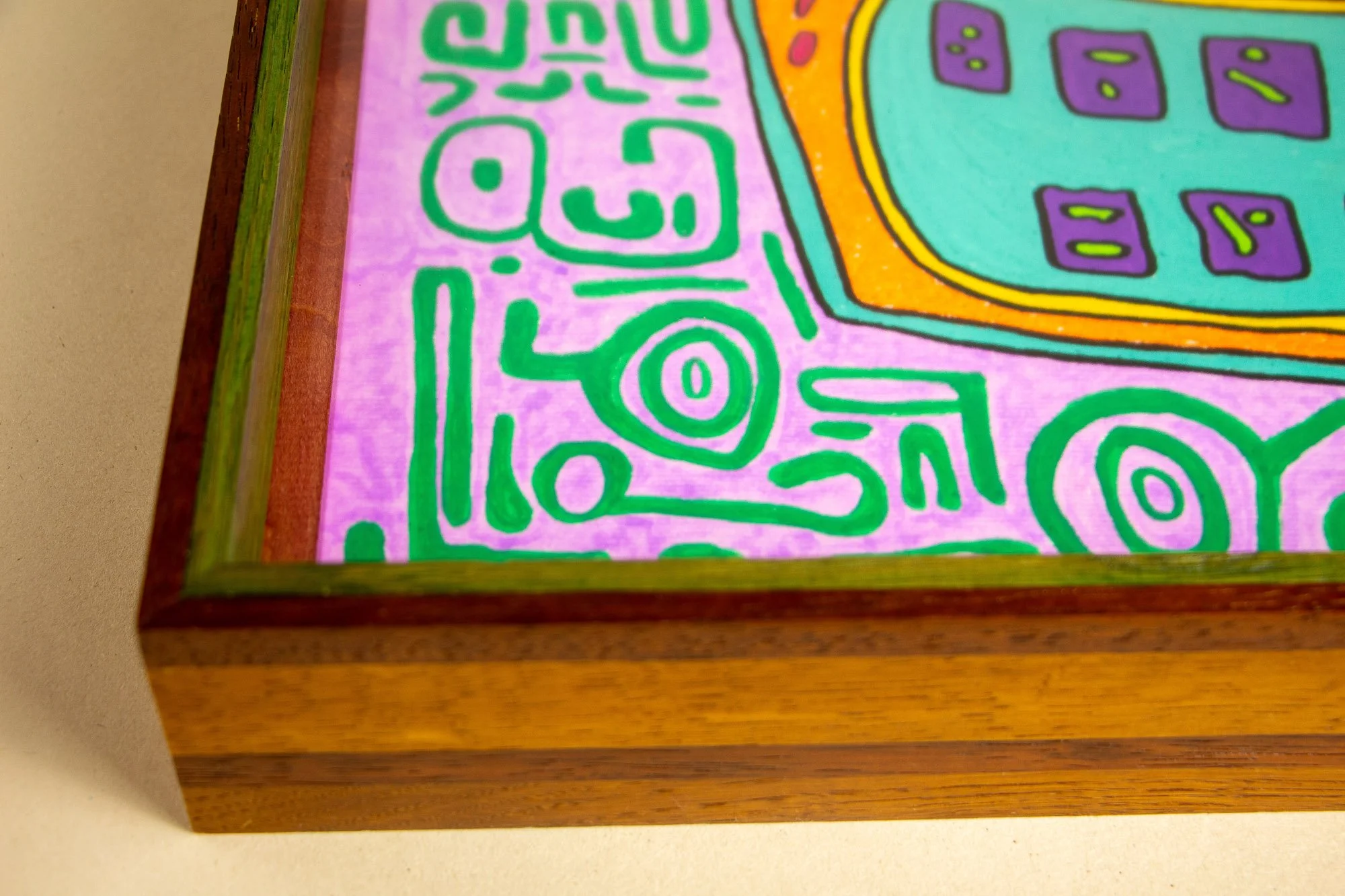 Unseen Signifiers 002 frame detail: three-quarter view of the lower-left corner, showing how the frame’s layered brown, green, and reddish tones continue around the lilac-and-green composition. mahogany, oak and beech wood.