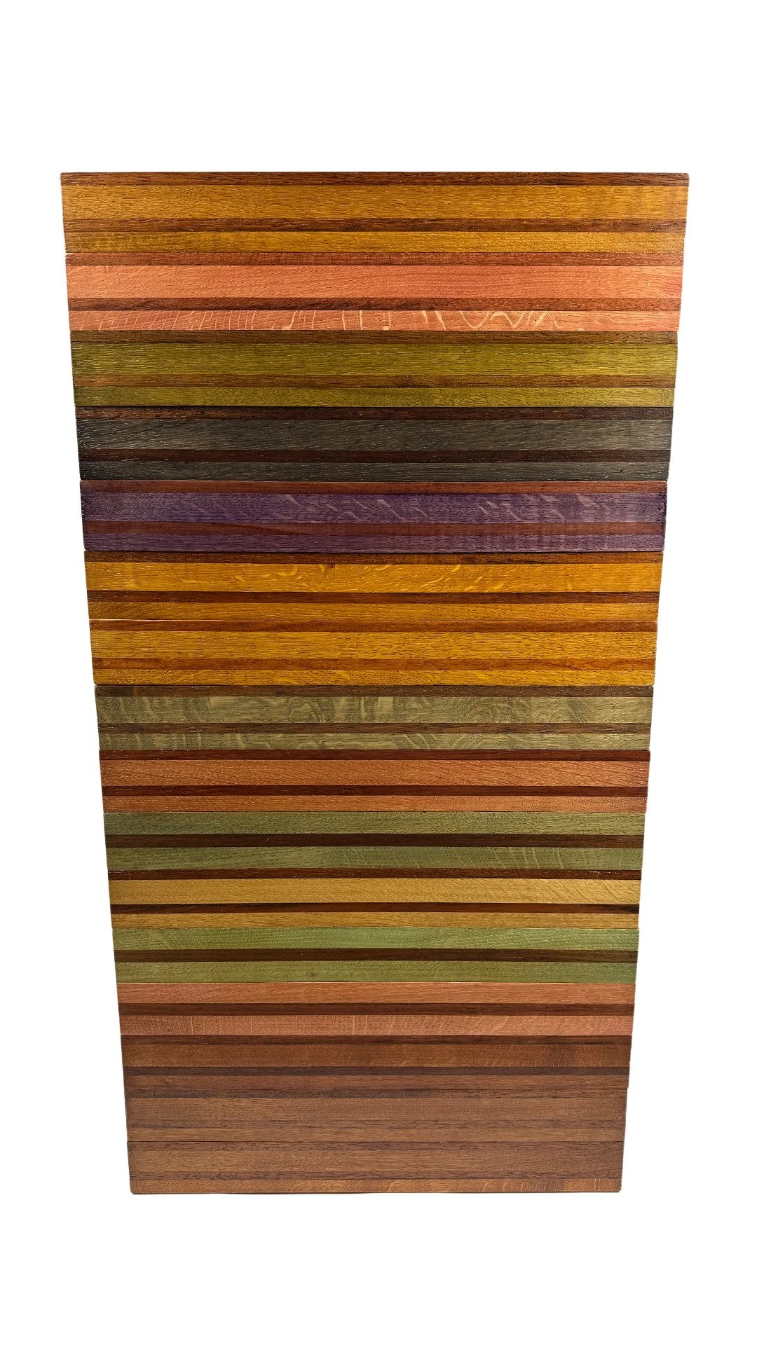 A wooden cutting board with a patchwork design made of different layers of wood in various colors, arranged in horizontal stripes.