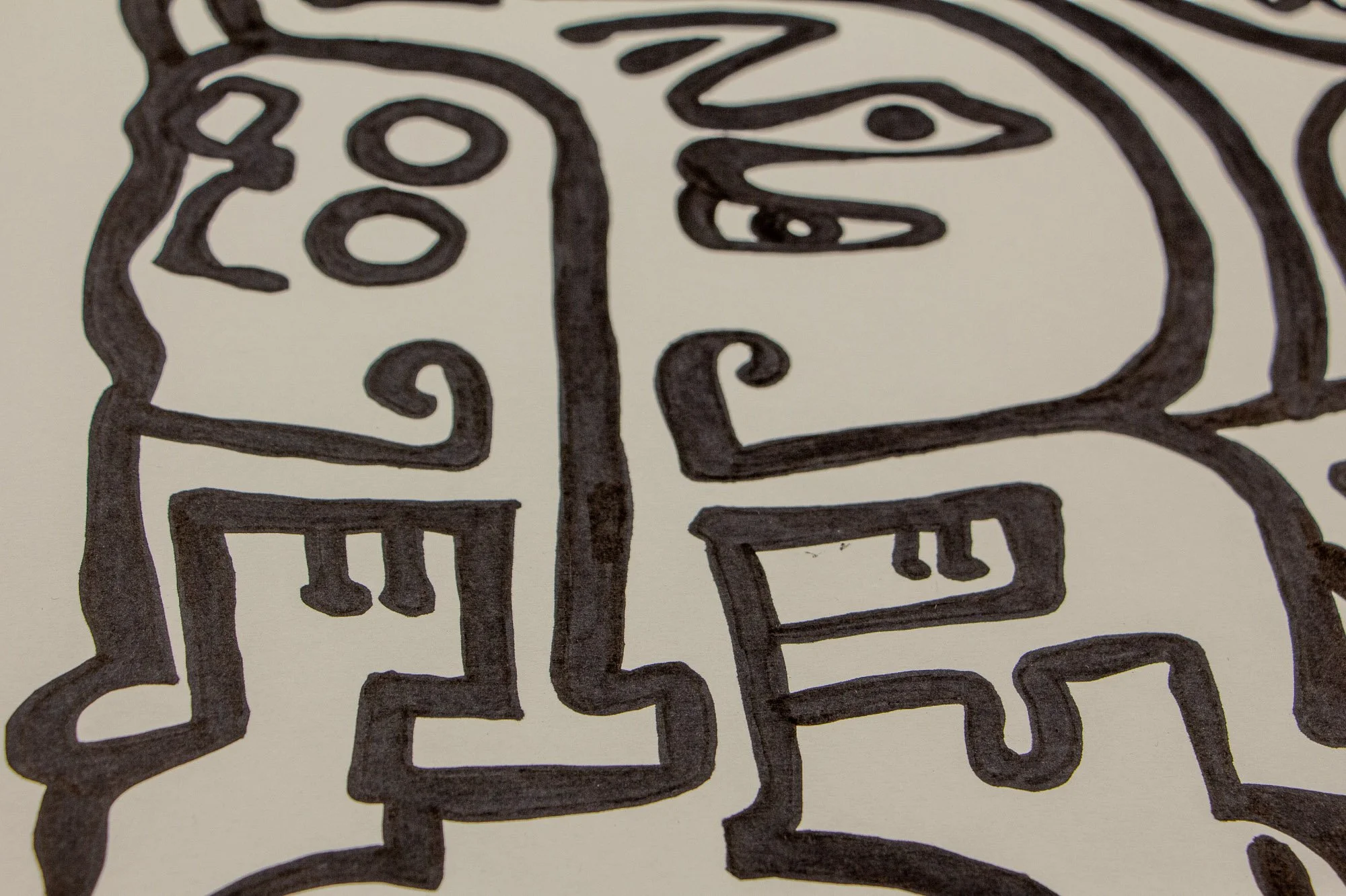 Elusive Cocoon 002 detail: wider close-up of interlocking face-like figures with elongated noses, a squared mouth, heavy-lidded eyes, and a central smiling form rendered in bold black lines.