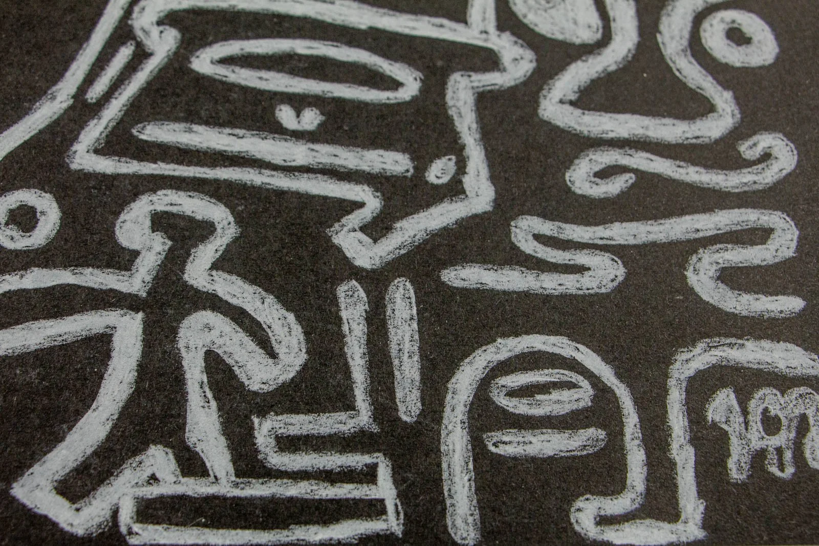 Synaptic Mythos 002 detail: miniature running figure beside ladder-like bars and rounded head glyphs; bottom-edge vignette with chalky white on deep black