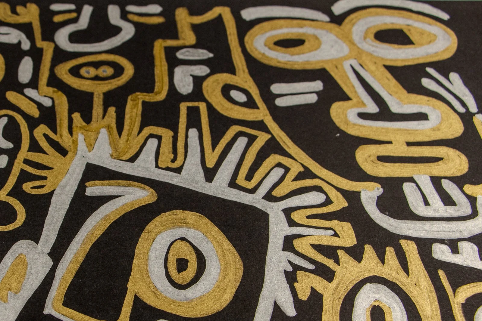 Golden Nostalgia 001 detail: crown spikes radiate around a single large eye; gold rim with a pearly silver core