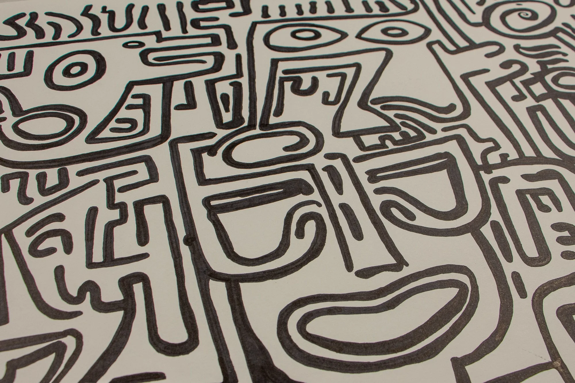 Resonant Syntax 001 detail: oblique close-up of the central mask, with almond eyes, long angular nose, and broad curved mouth; bold black contour lines on warm white paper