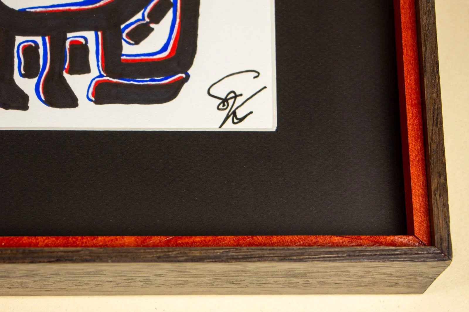 Flux Impromptu 002 frame: signature corner, white paper reveal with artist mark; red liner traces the throat against the dark oak outer
