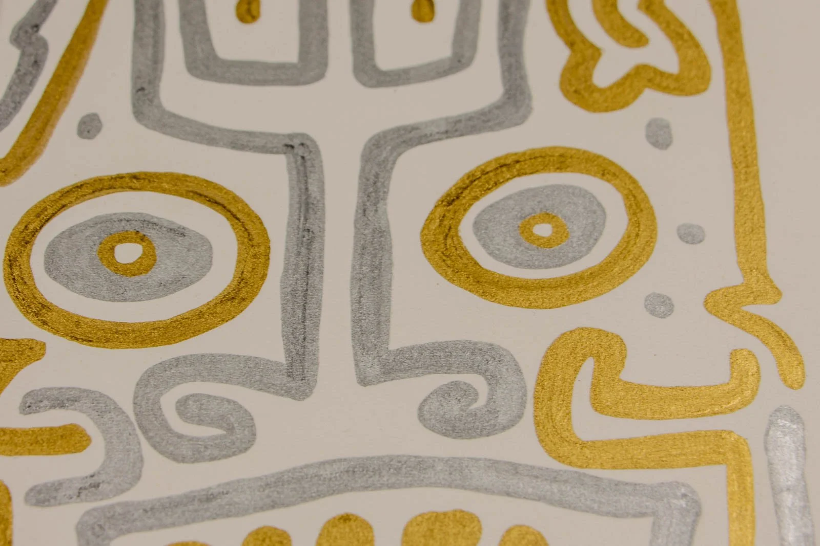 Golden Nostalgia 003 detail: spiral accents, twin ringed eyes and curling silver scrolls; floating dots punctuate the field