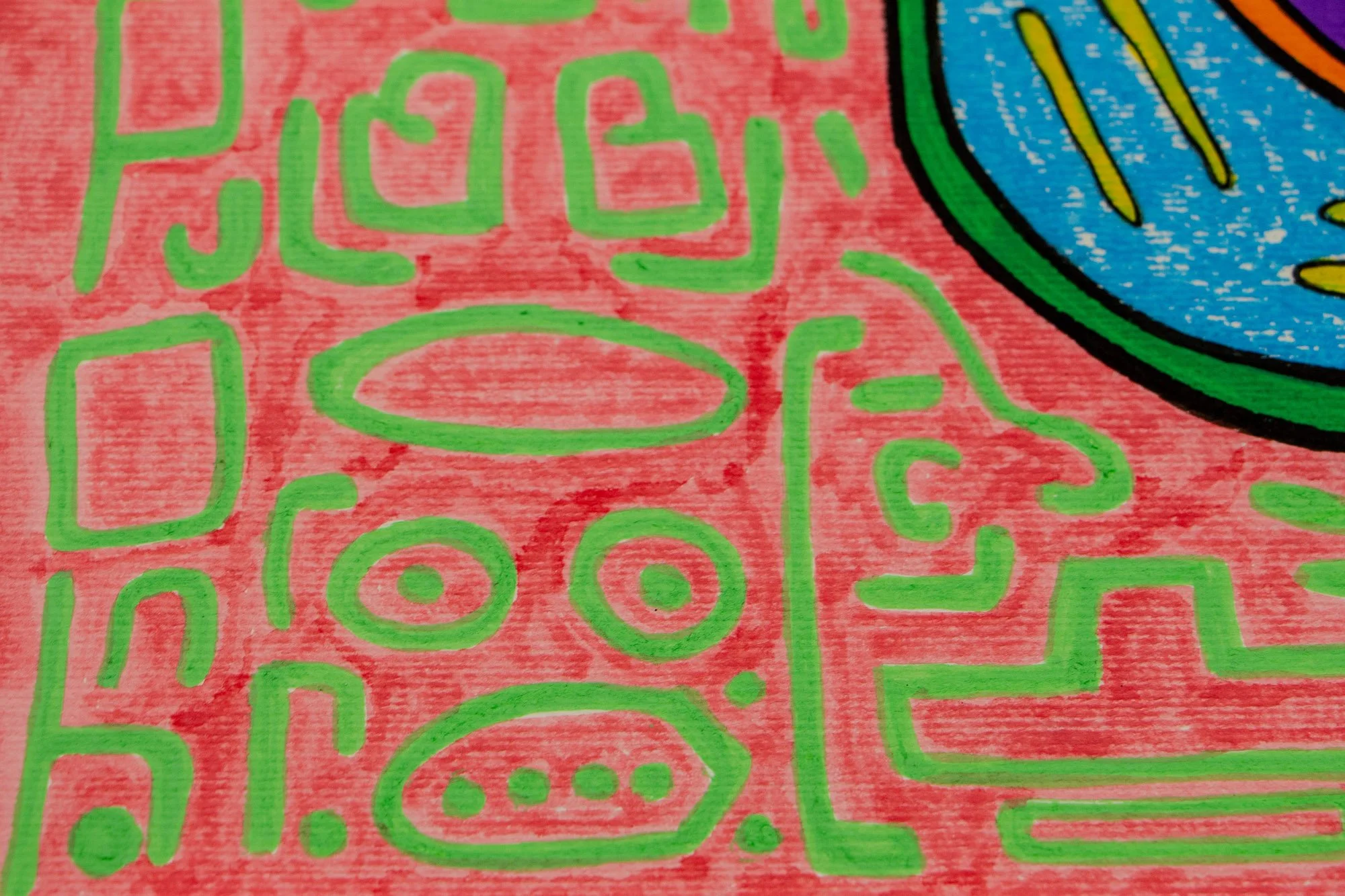 Unseen Signifiers 001 detail: close-up of the pink background with green symbolic linework, including a face-like figure with oval eyes and a rounded mouth.
