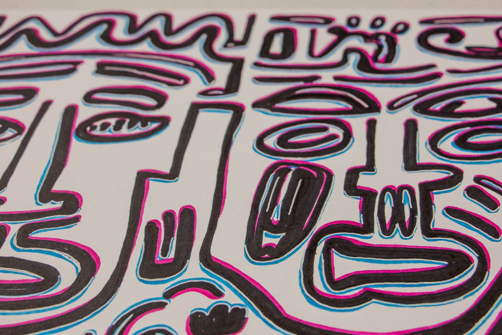 Silence’s Caesura 002 detail: brow-line panorama, two tall heads with flame-like hair and block noses; black marker channeling light-blue and pink registers