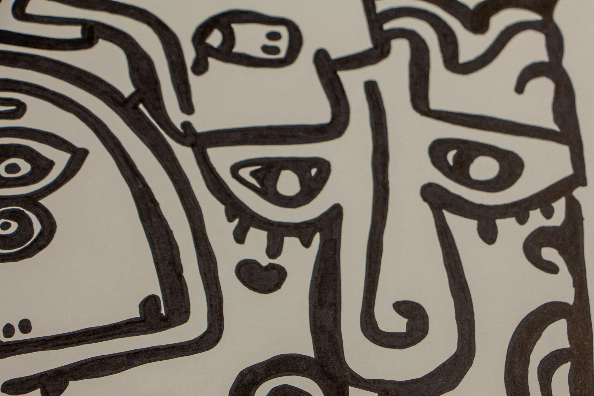 Elusive Cocoon 002 detail: broad section of the composition showing multiple overlapping abstract faces, almond eyes, geometric mouths, and flowing contour lines across warm white paper.