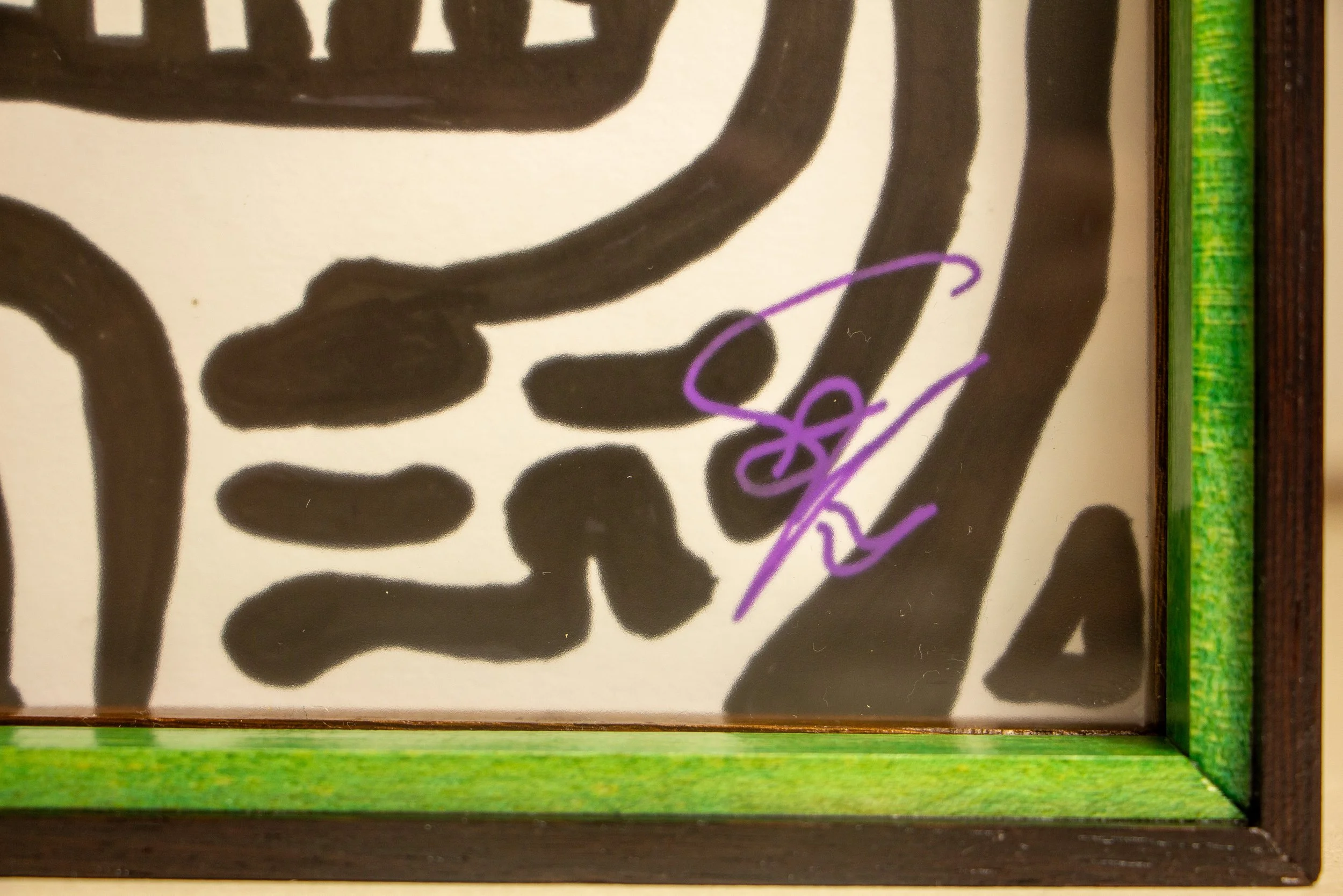 Formless Equation 001 frame: lower-right signature behind glass, green spacer and wengé inner lip