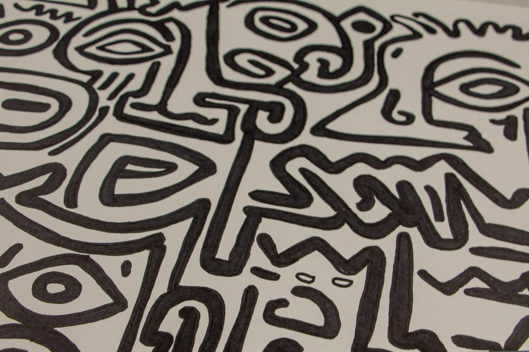 Resonant Syntax 002 detail: angled section with curved profile, almond eye, and zigzag wing-like form; interlocking black contours on warm white paper