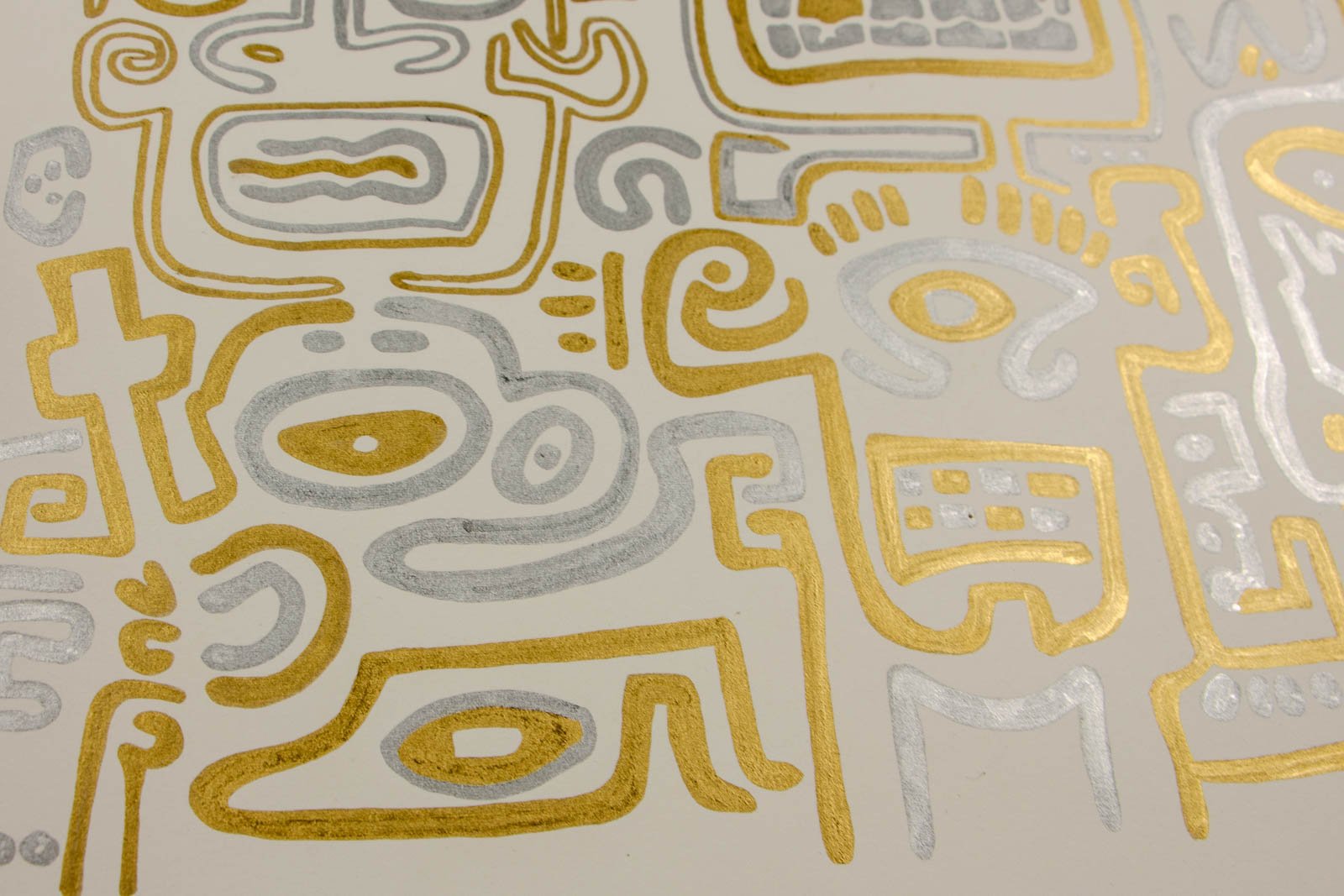 Golden Nostalgia 003 detail: glyph field, cross form, eye-ovals, and stacked signs; gold rides a soft silver trace; creamy sheet visible between lines