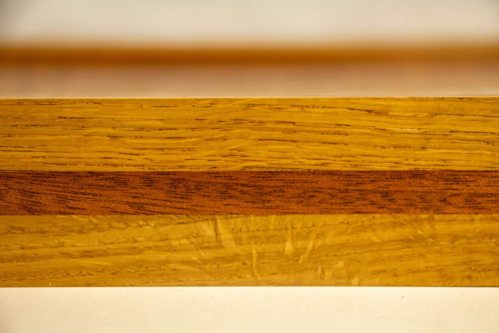 Golden Nostalgia 003 frame:  upper oak rail above and under the mahogany stripe; satin finish
