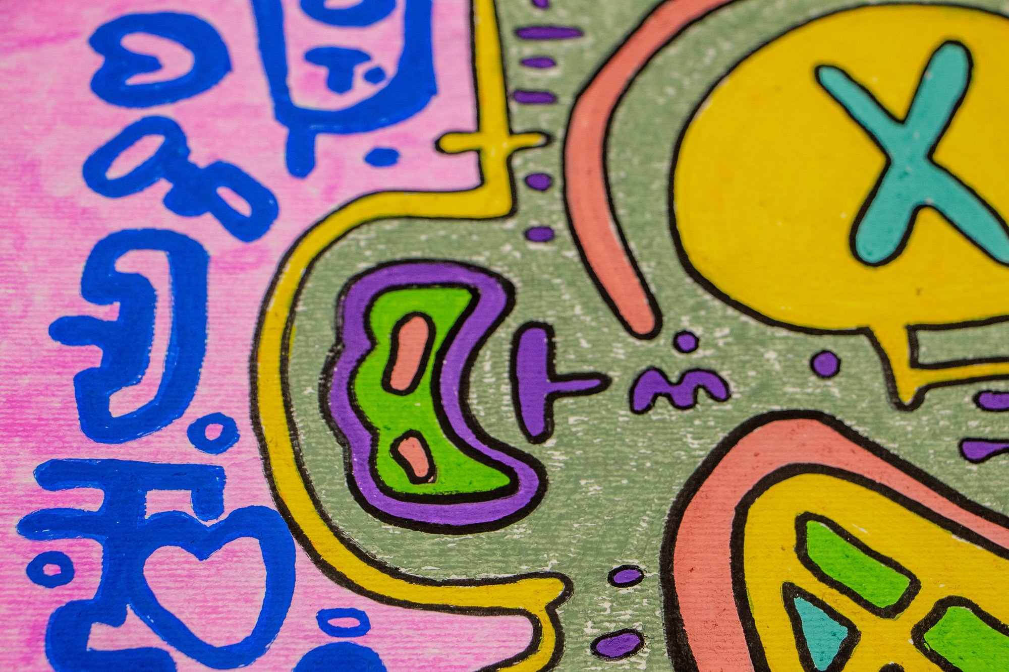 Unseen Signifiers 007 detail: close-up of the left side of the face, showing a yellow contour line, a small green and purple side motif, and blue symbols on the pink background.