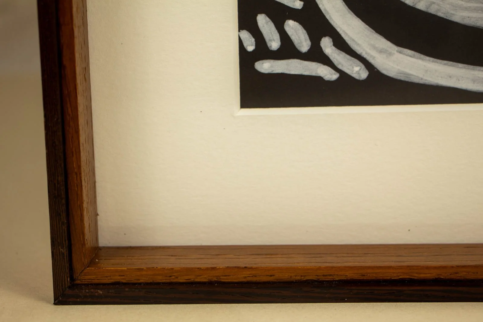 Metamorphic Entwining 001 frame: lower-left front corner with ivory mat and wengé foot, neat rabbet