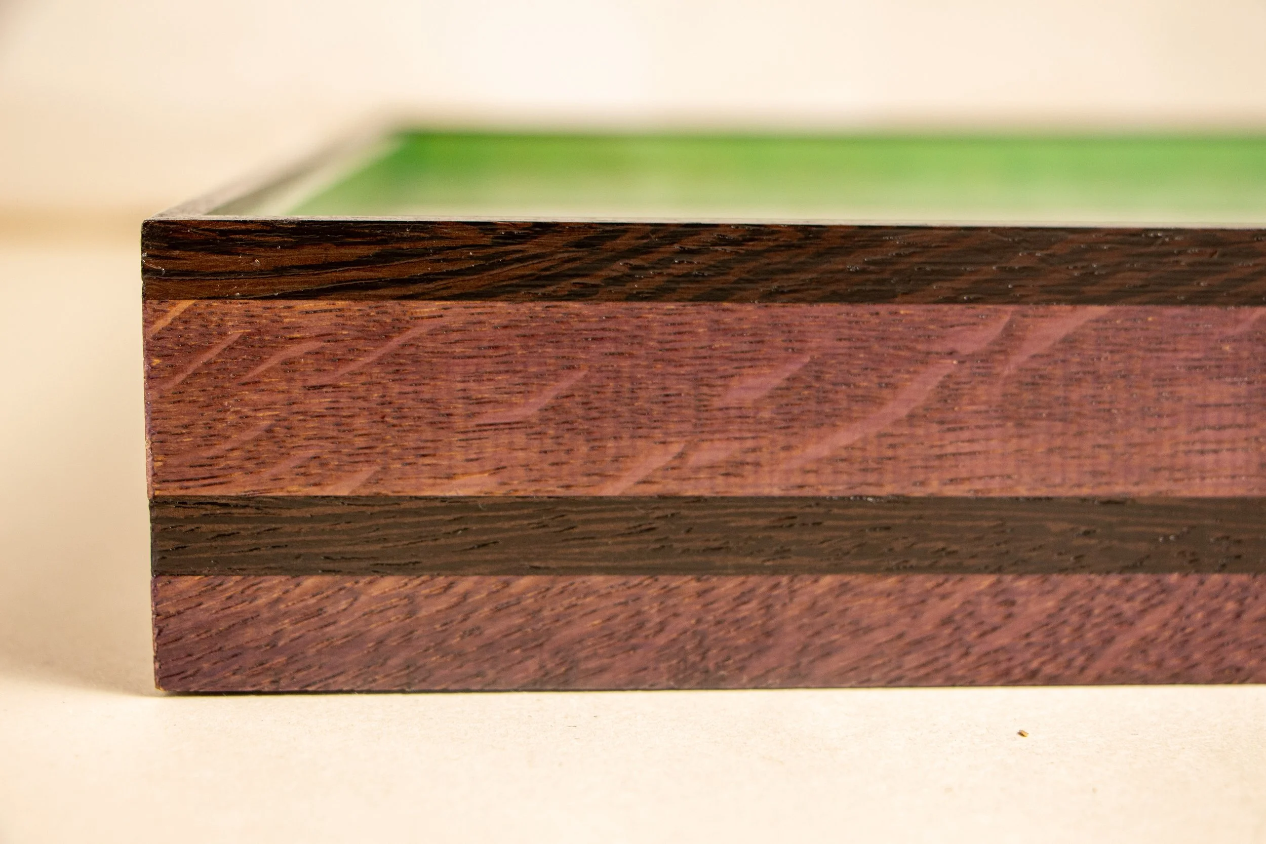 Formless Equation 001 frame: close-up of purpleheart figure with subtle wengé inlay line
