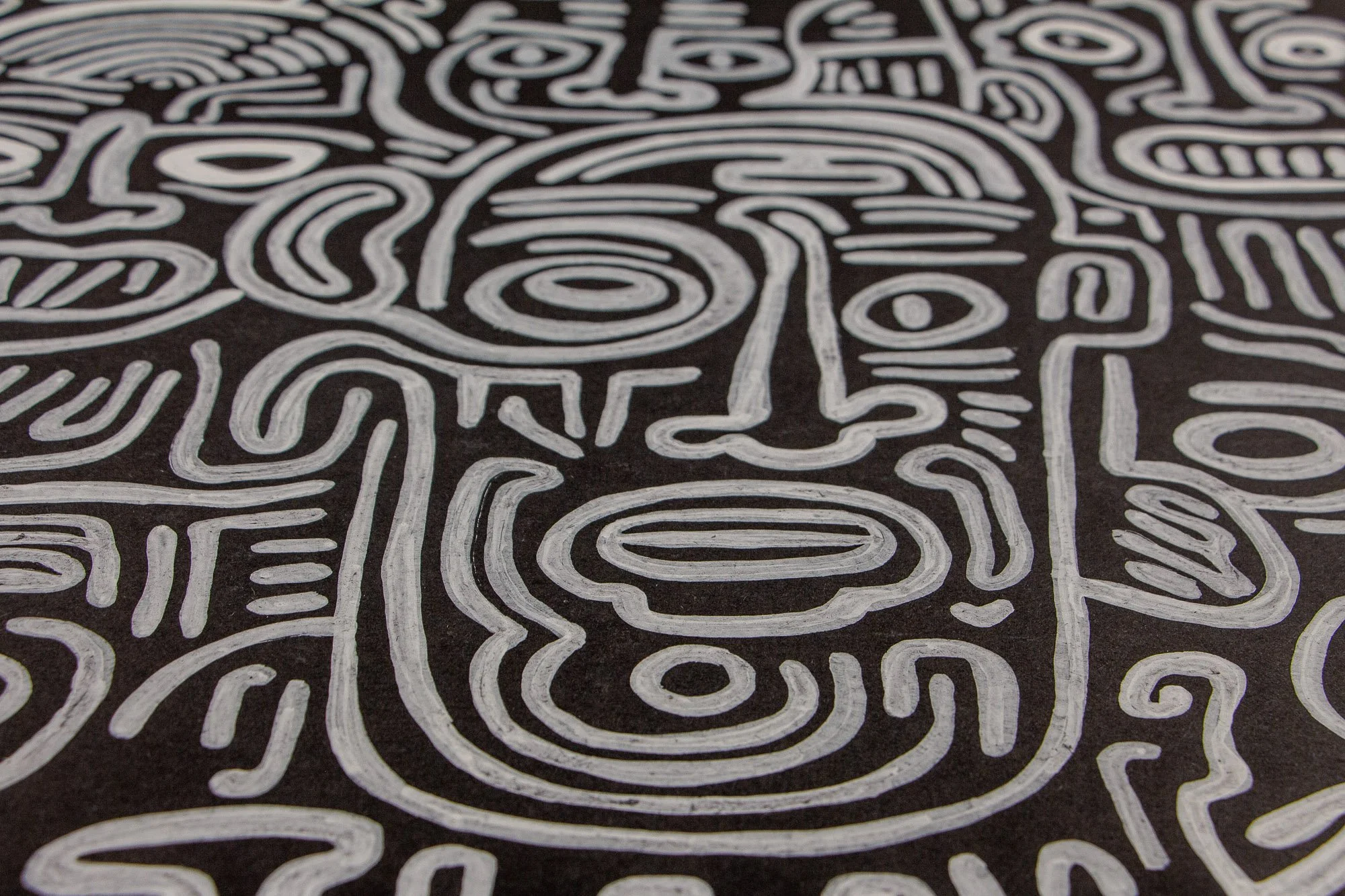 Mêlée of Discovery 001 detail: broader view of the main central face and its surrounding network of figures, revealing how the composition holds multiple expressions and directions in one continuous structure.