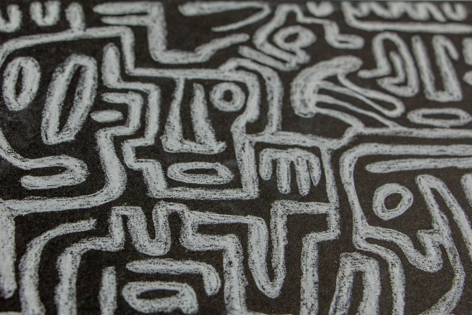 Synaptic Mythos 003 detail: three small visages in a row, comb marks and bars for features; compact, evenly weighted lines