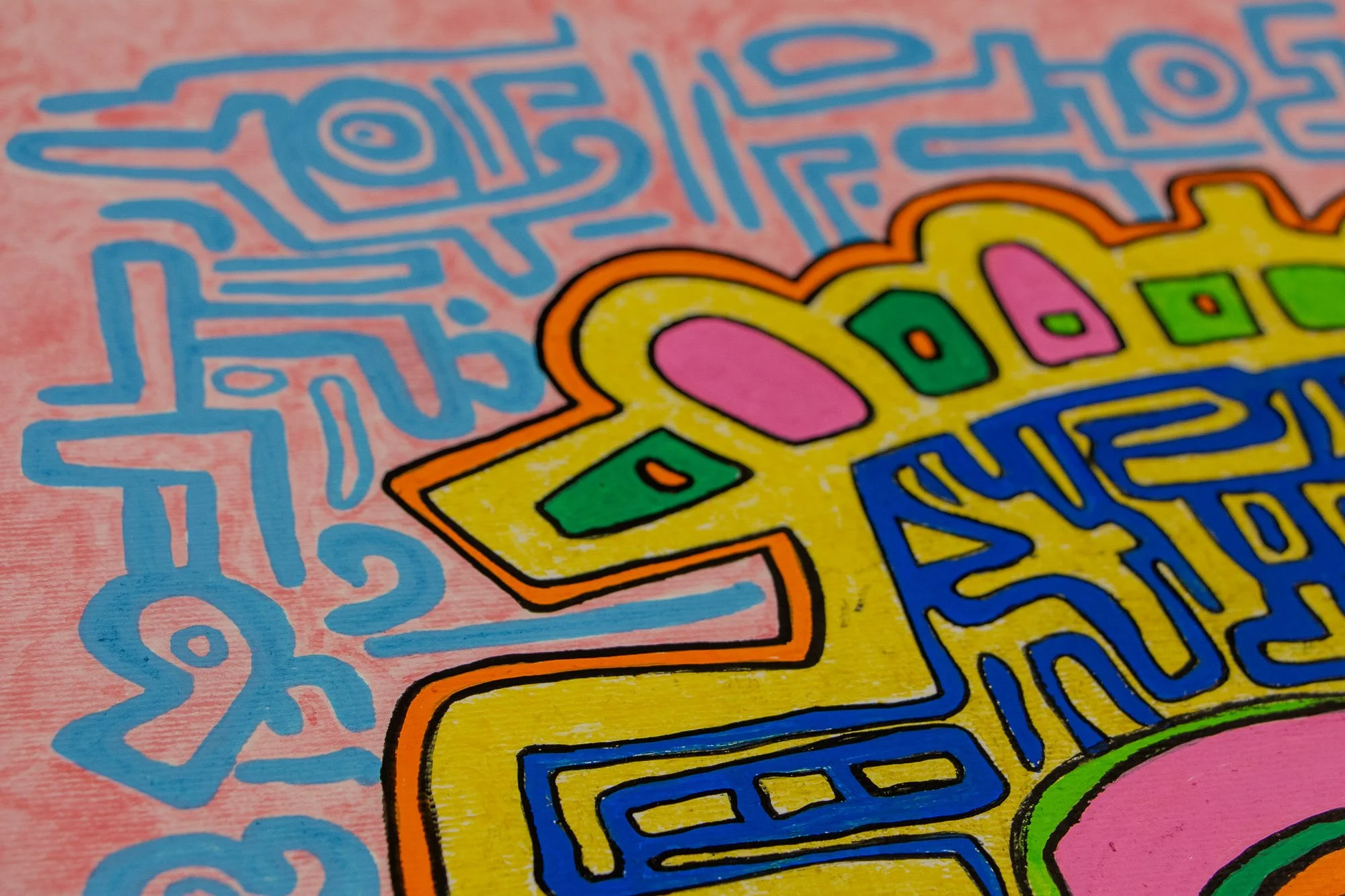 Unseen Signifiers 006 detail: upper-left peripheral close-up showing light-blue symbolic linework across the pink background beside the yellow facial border.