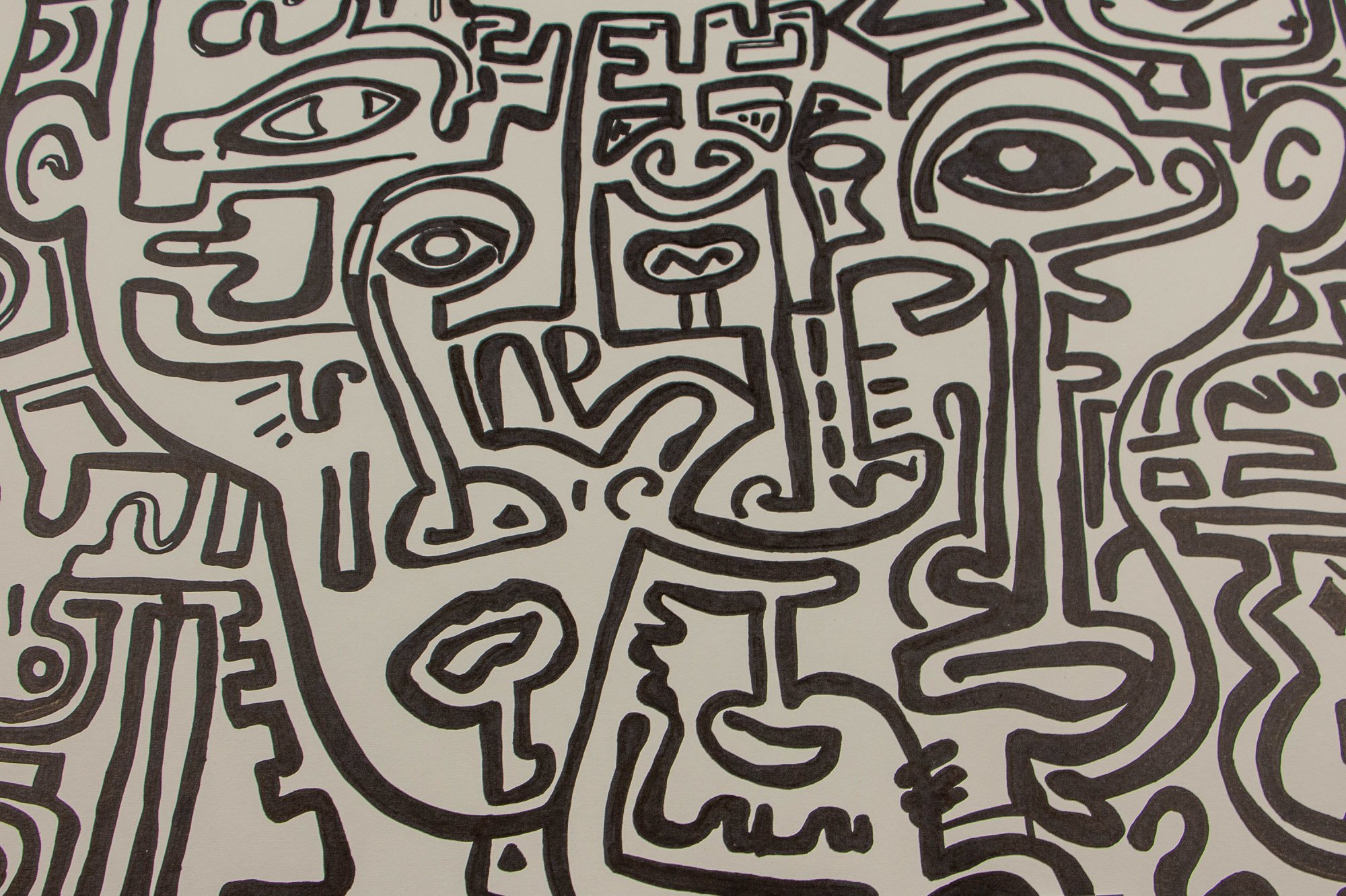 Elusive Cocoon 003 detail: near-full close-up of a clustered face-like composition, showing a large eye at right, an elongated profile at left, a narrow central mask-like figure, and dense surrounding black symbolic linework on a pale ground.