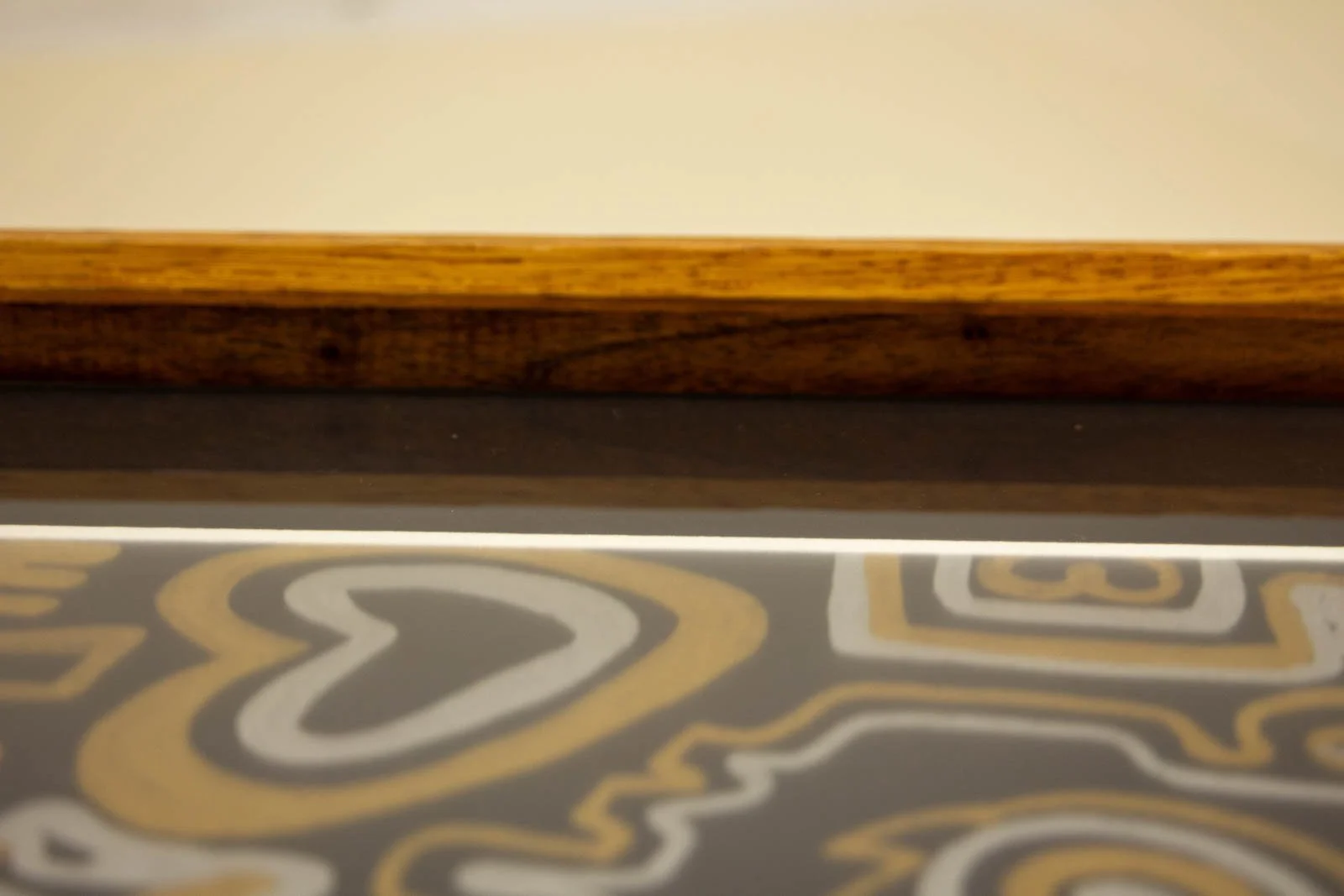 Golden Nostalgia 001 frame: inner corner, walnut spacer and glazing line visible; neat fit against the window mat