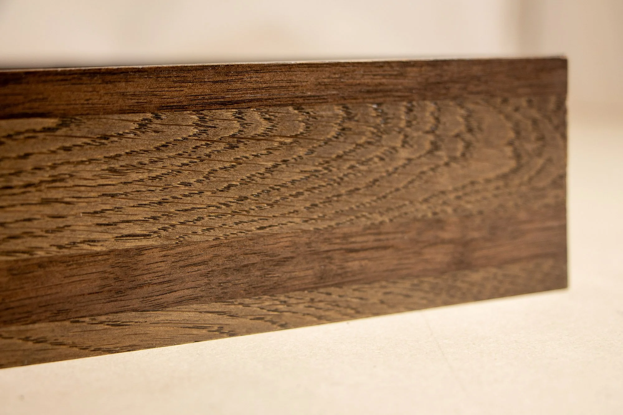 Close-up of a wooden surface showing detailed wood grain patterns.