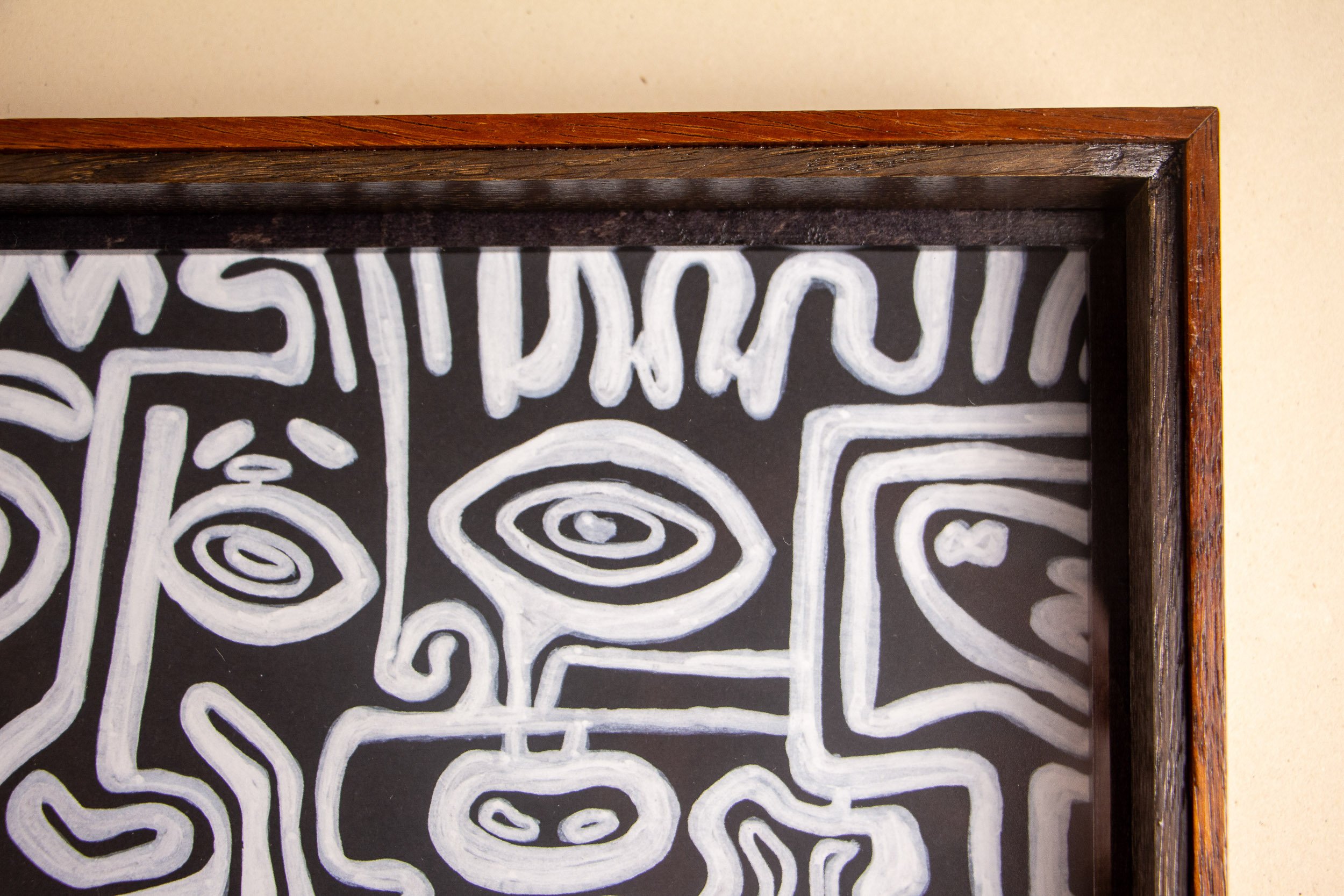 Turbulent Aegis 003 frame detail: close-up of the front upper corner, showing the warm outer frame, dark inner band, and the way the layered structure draws the eye inward toward the artwork.