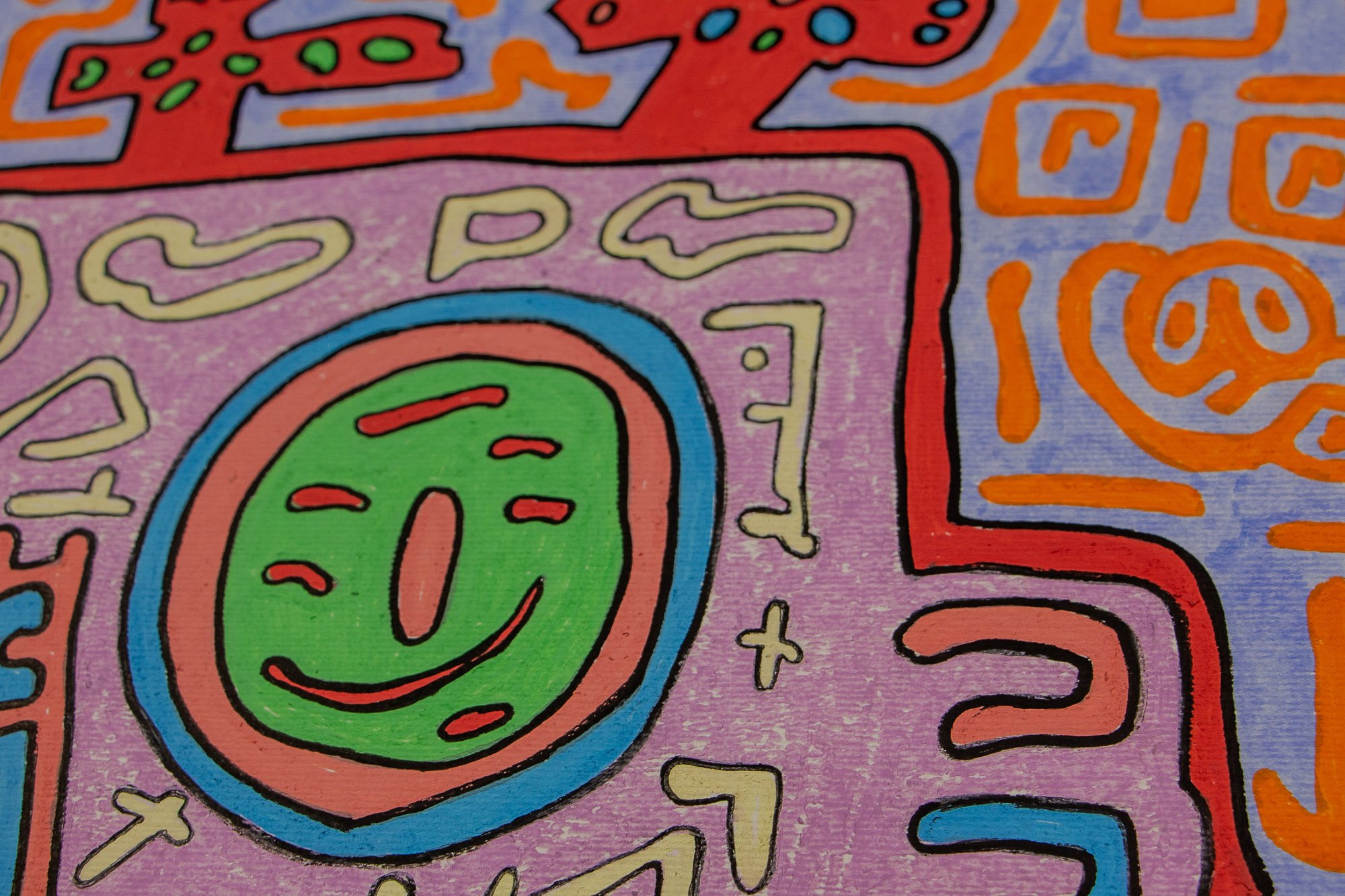 Unseen Signifiers 010 artwork detail: close-up of the right side of the face, showing the green circular eye with red marks, framed by blue and pink rings, beside the red outer contour and orange background symbols.