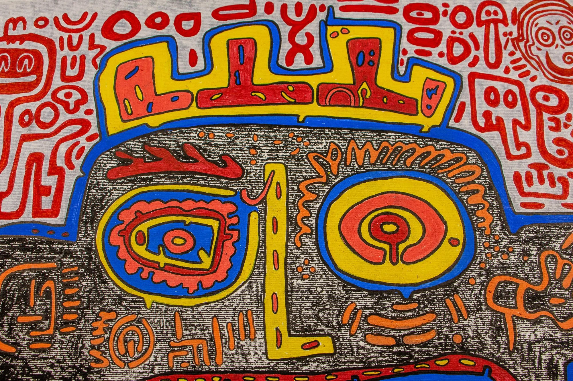 Unseen Signifiers 003 detail: near full view of the face, showing the crown-like top form, contrasting circular eyes, yellow nose bridge, and the large blue mouth anchored in the lower half.