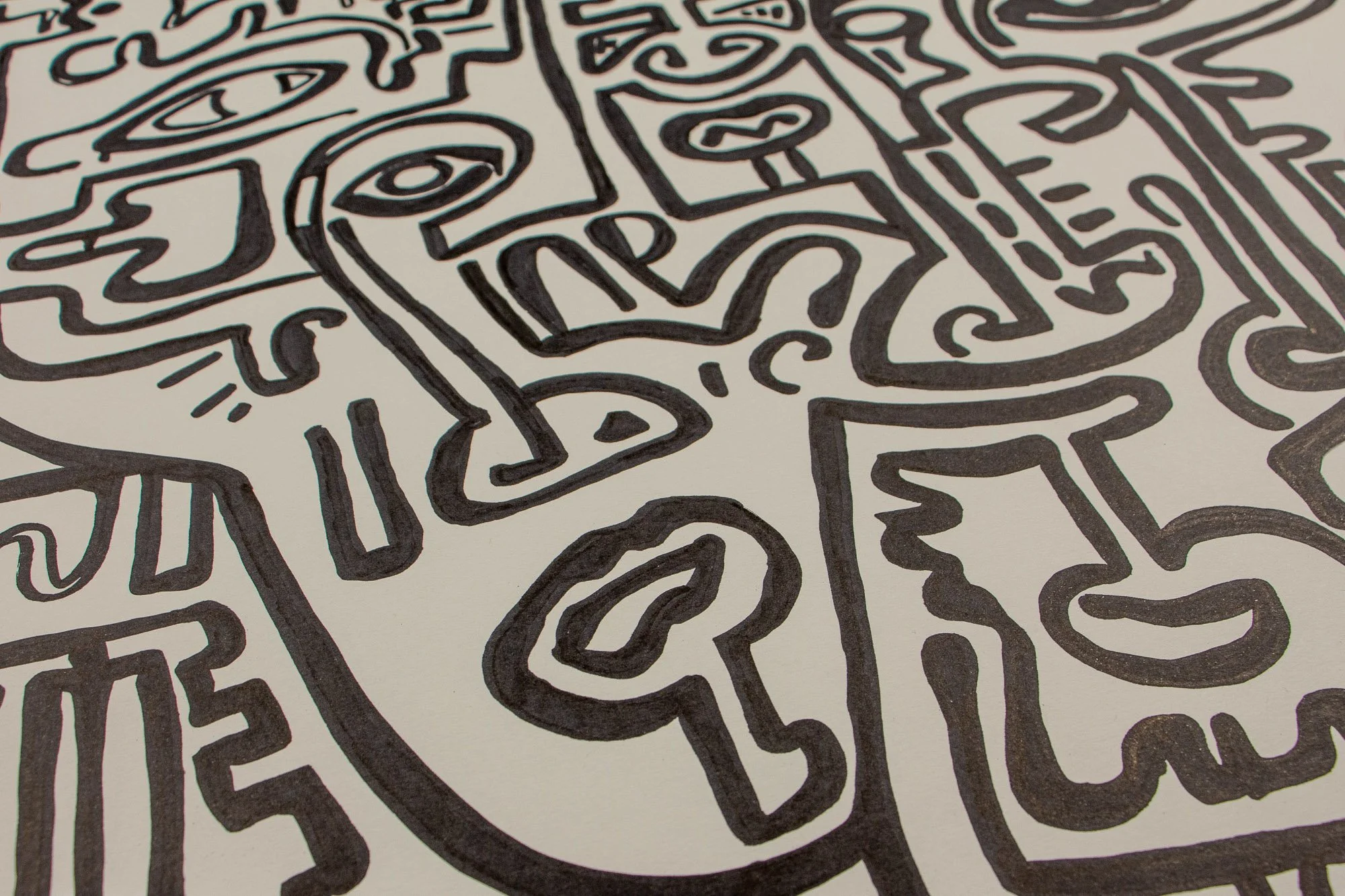 Elusive Cocoon 003 detail: angled close-up of the left-central area, showing an elongated profile with a circular eye, a branching hand-like form, a key-like symbol below, and surrounding black linework on the pale surface.