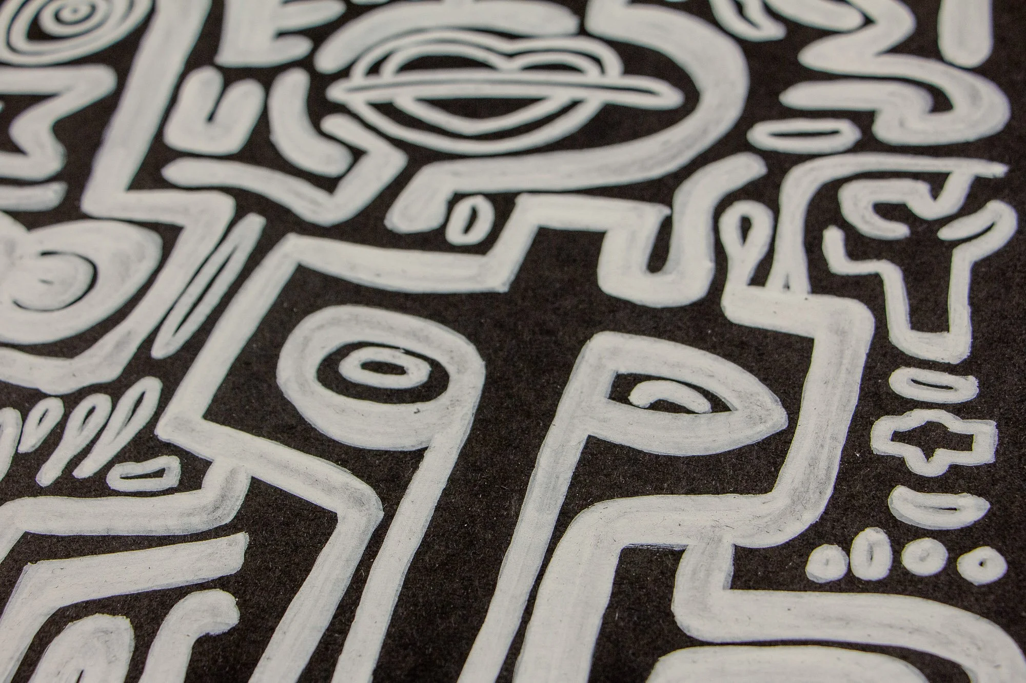 Turbulent Aegis 002 artwork detail: abstract close-up of interconnected white line work, showing curved and angular forms that suggest emotion, movement, and layered symbolic language.