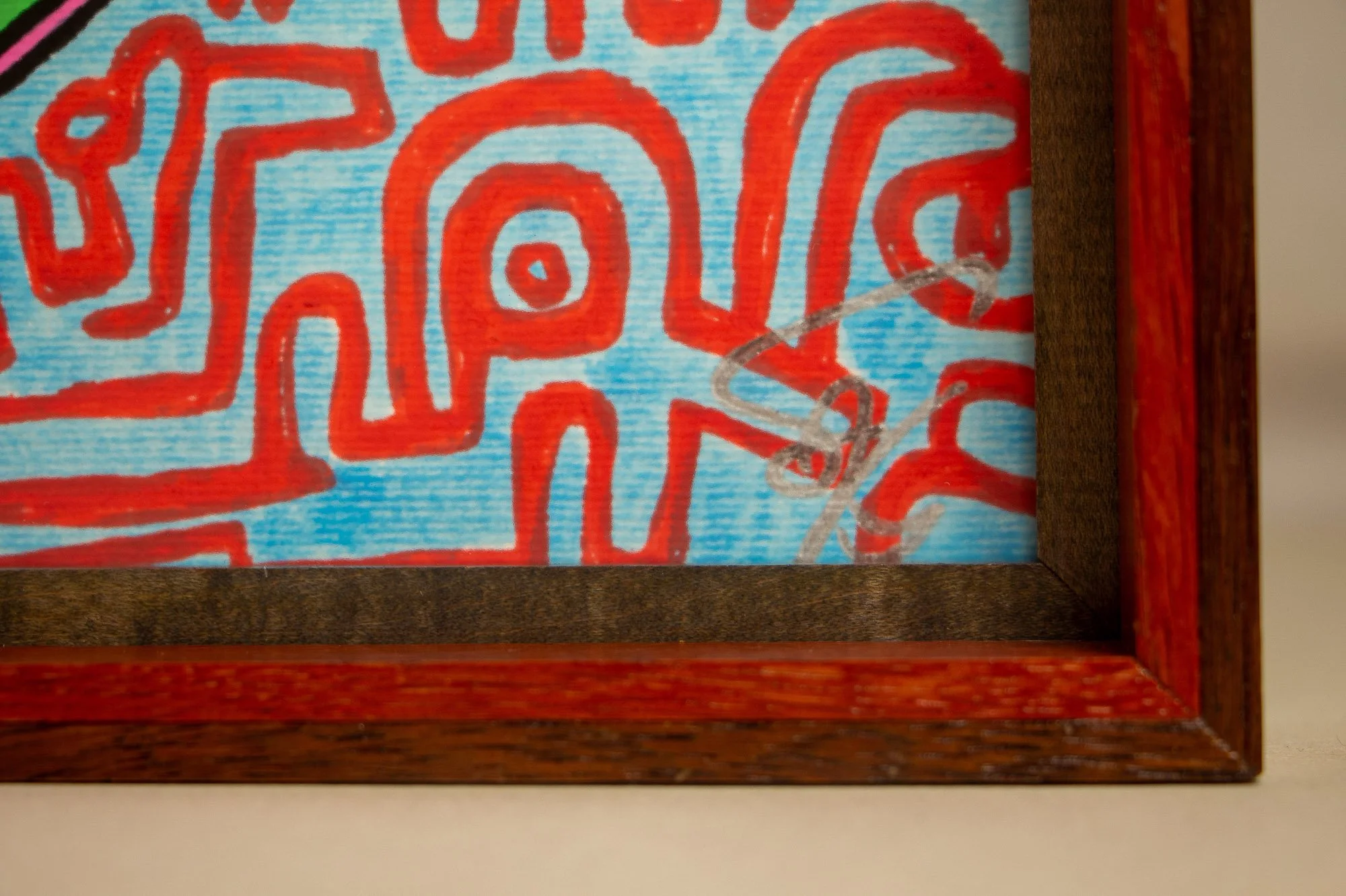 Unseen Signifiers 008 frame detail: close-up of the signed lower-right corner, showing the silver signature beside the dark inner border and red inner frame edge. mahogany, oak and beech wood.