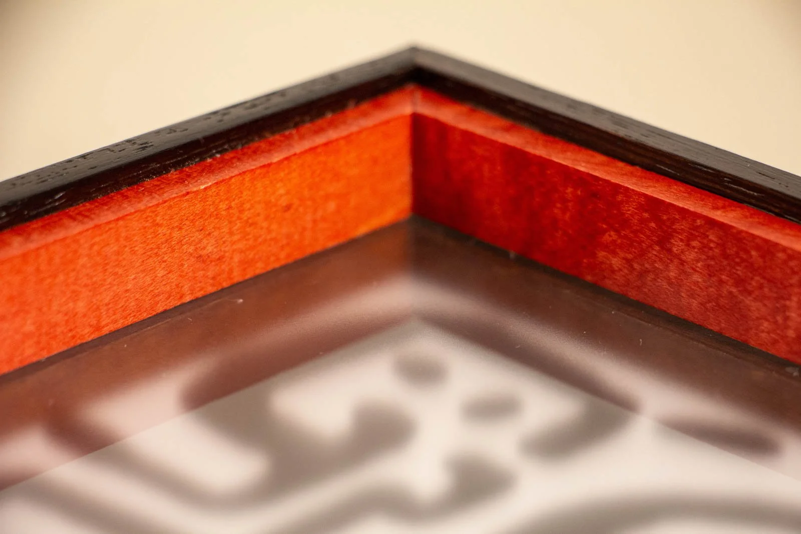 Formless Equation 002 frame: inner corner with red spacer, crisp shadow gap, wengé lip