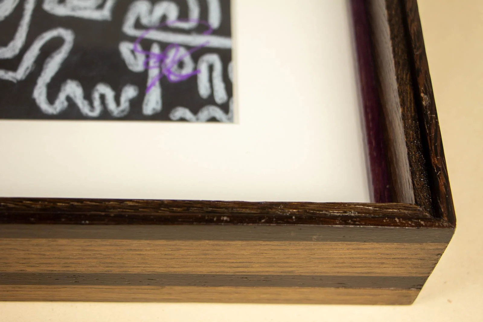 Synaptic Mythos 002 frame: top rail inside, purple signature; slight shadow gap between mat and glazing