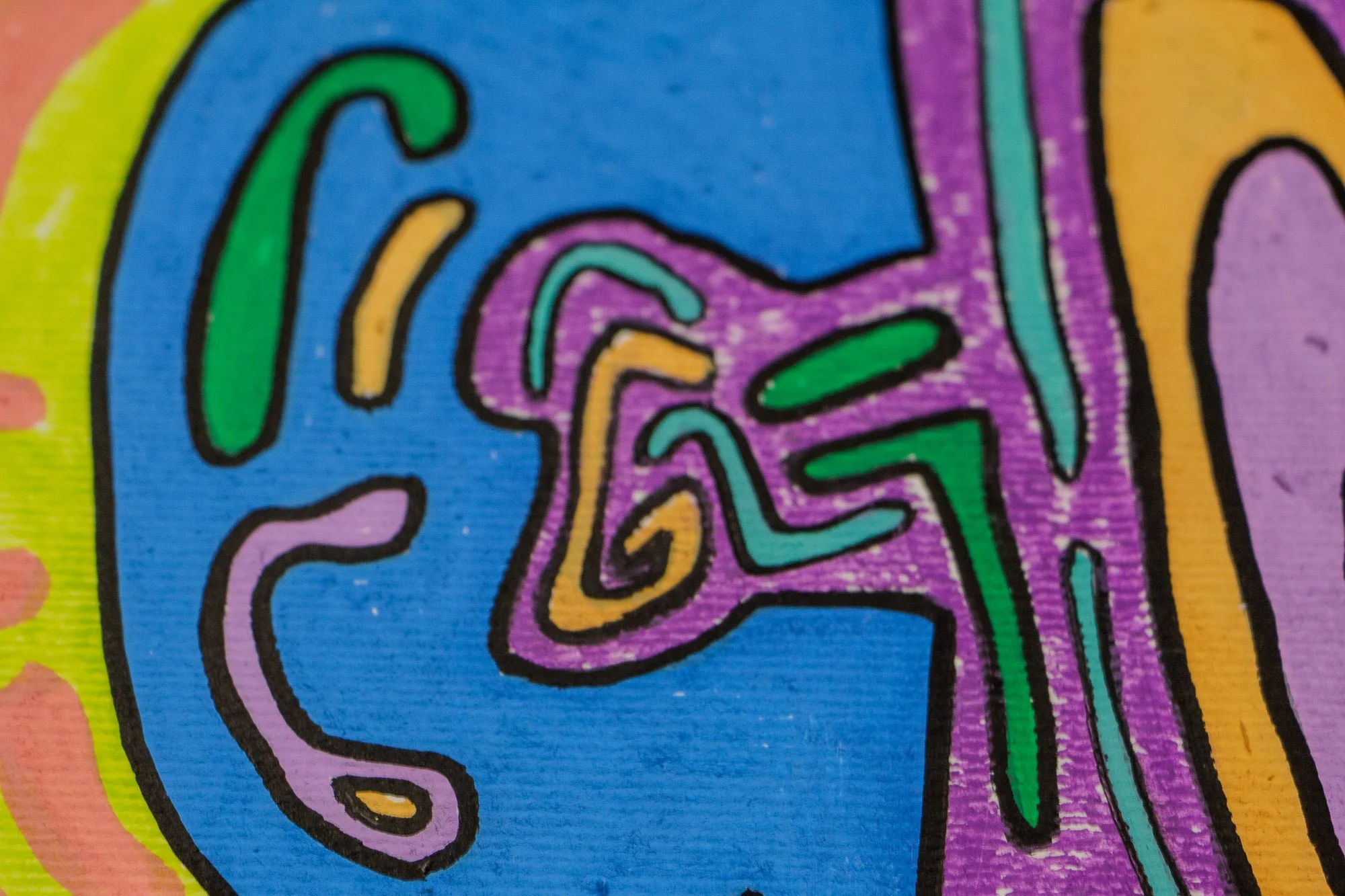 Unseen Signifiers 009 artwork detail: close-up of a small interlocking spiral motif in lavender, turquoise, and gold, set inside a blue shape at the lower edge of the composition.