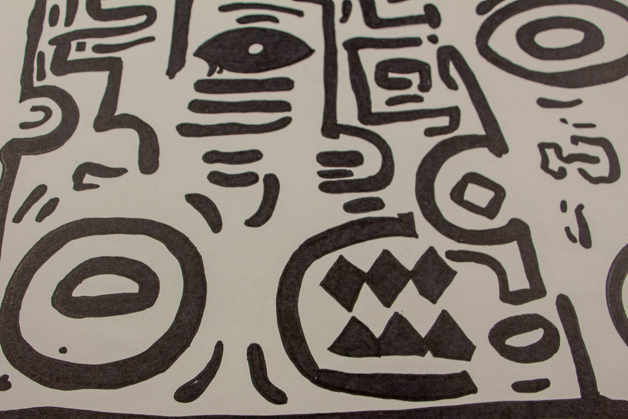 Elusive Cocoon 001 detail: frontal close-up of the central field, with large concentric oval forms, compact glyph-like marks, and interlocking black contours moving across the paper surface.