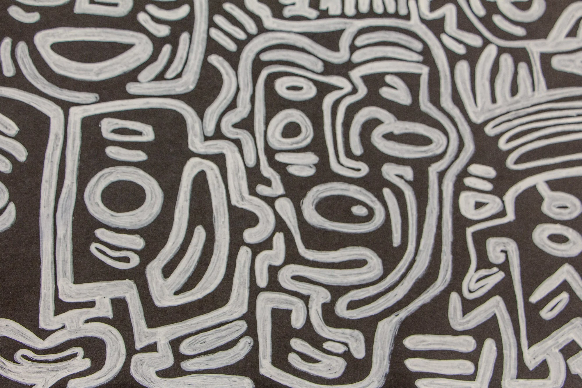 Mêlée of Discovery 005: close-up of an elongated face-like form with oval features and flowing contour lines, embedded within the dense composition.