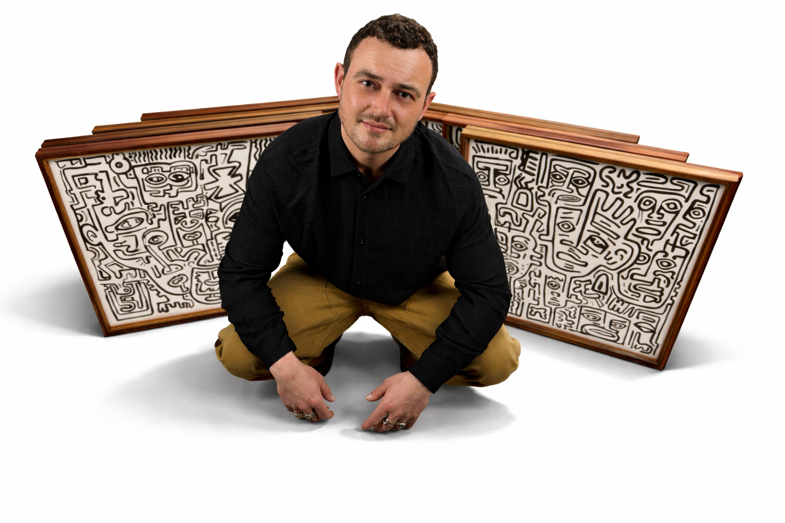 Stefan Knuist in front of artworks