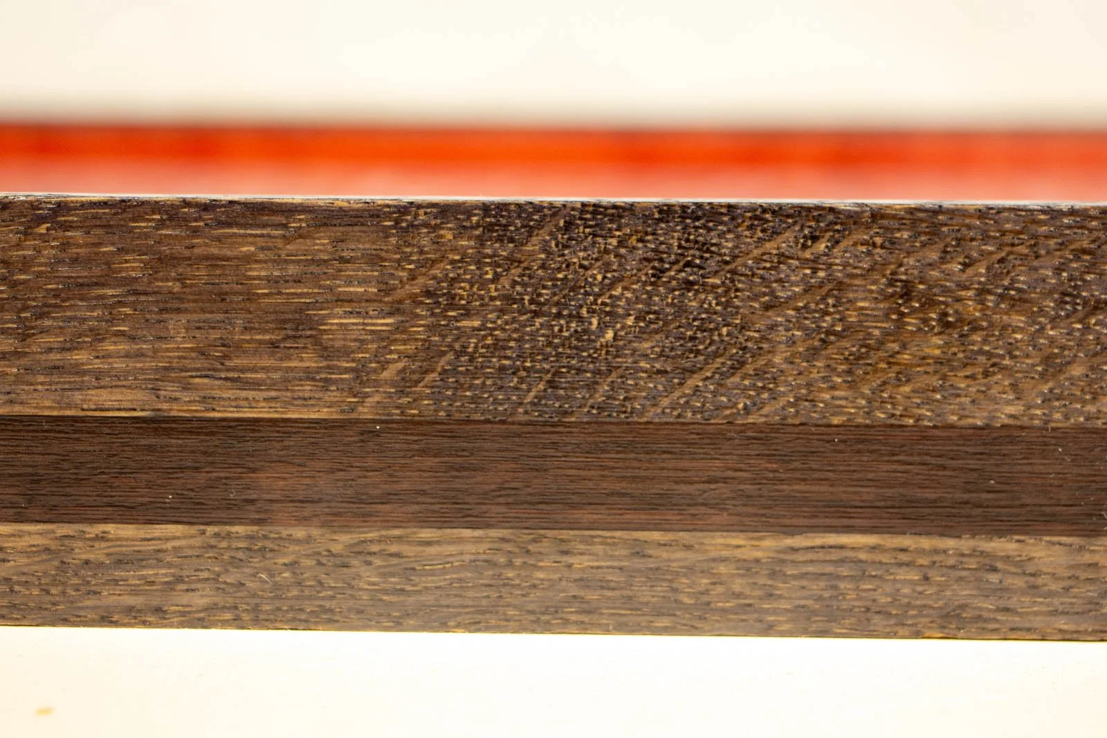 Flux Impromptu 002 frame: close crop, oak figure above/below the walnut accent strip; clean join, satin sheen