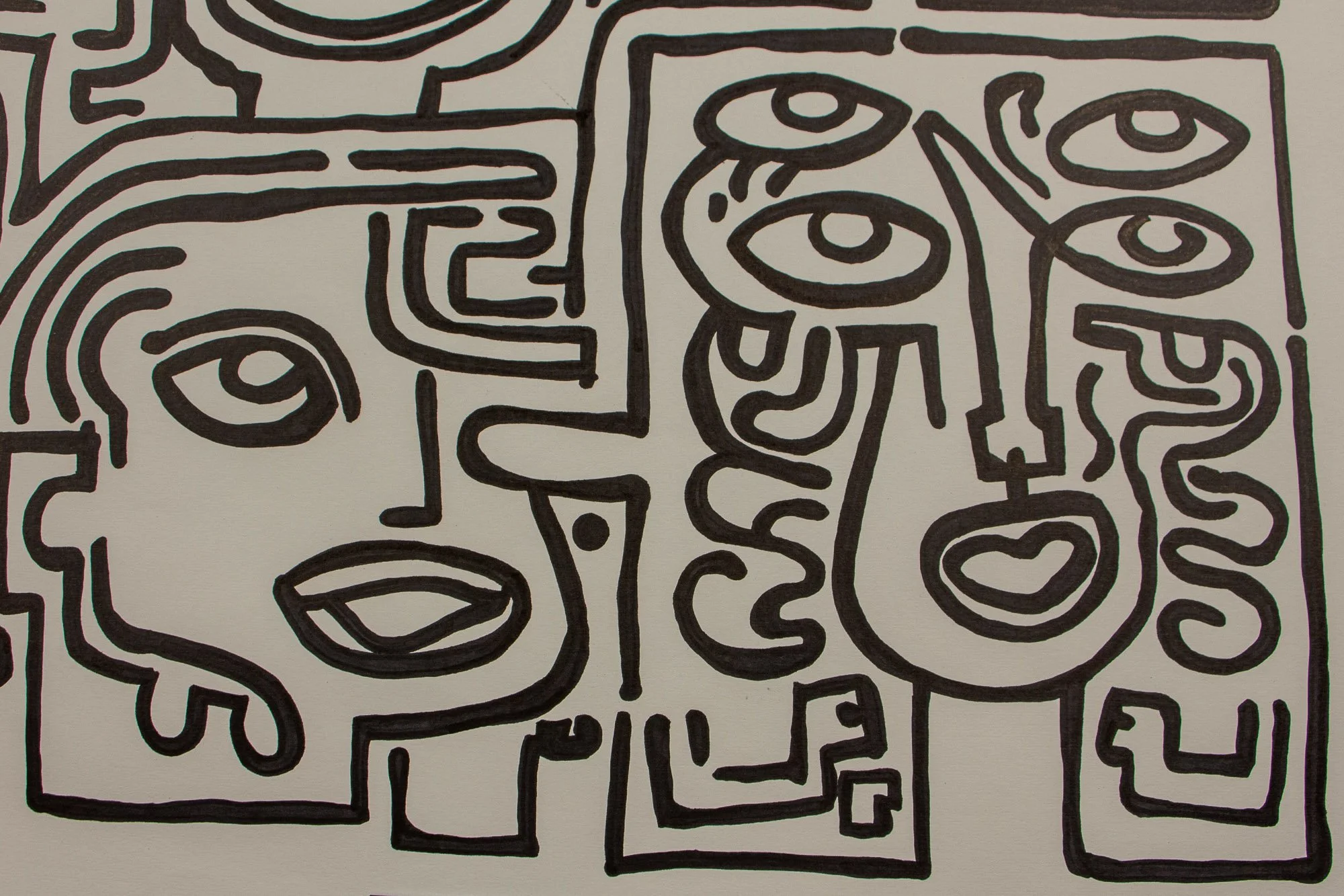 Resonant Syntax 001 detail: lower-right face pair, with one broad profile beside a vertical mask with stacked eyes and a small heart-shaped mouth; crisp black linework on warm white paper