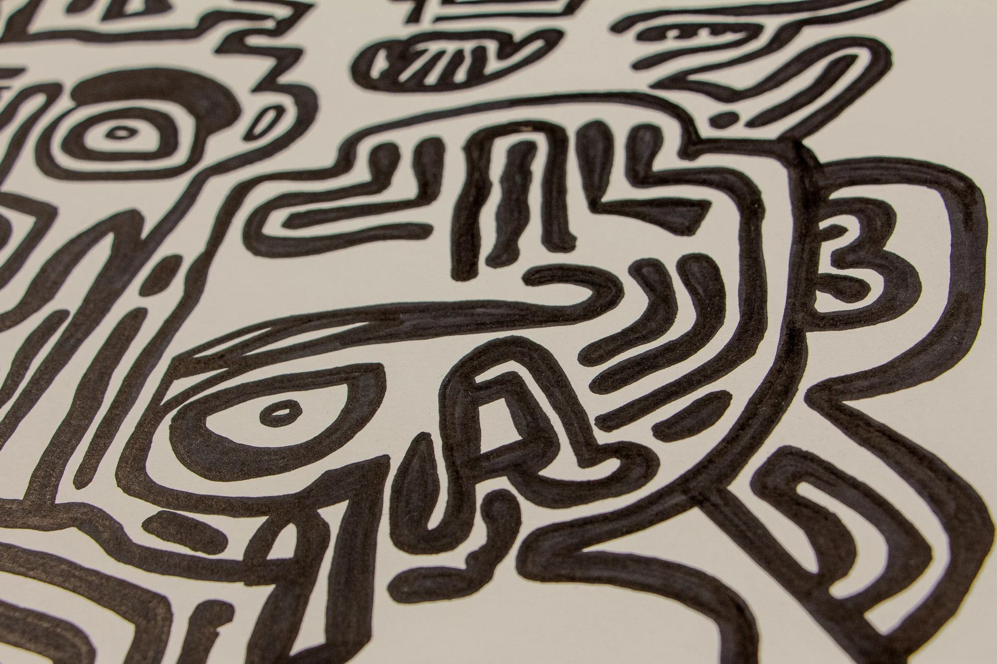 Veiled Alchemist 004 detail: close-up of a compact abstract figure with a single eye, striped forehead, and looping contours, showing the dense interplay of symbolic forms within the composition.