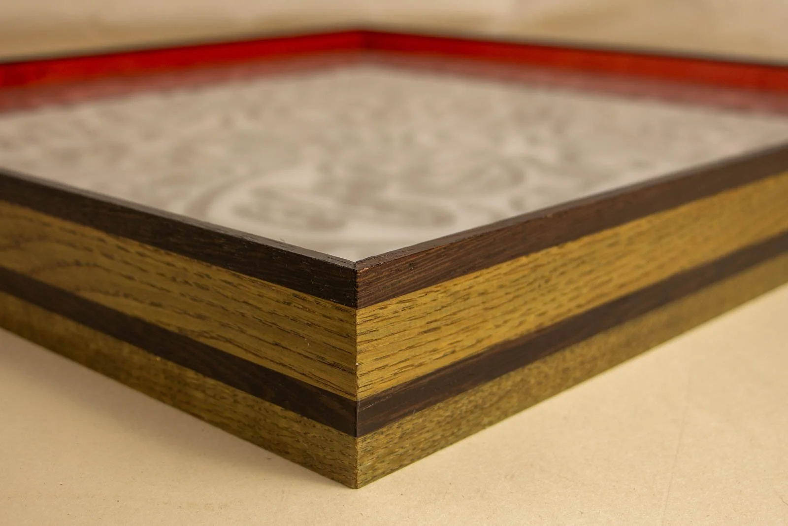 Formless Equation 002 frame: layered oak profile with wengé stripes, artwork beneath matte glass